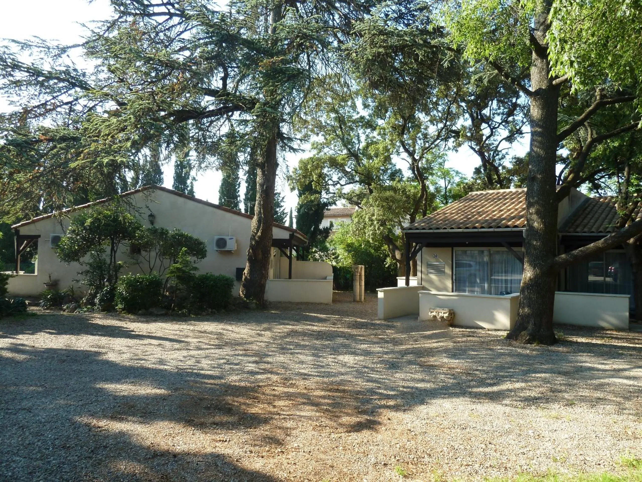 Garden in Logis Hôtel - Restaurant Résidence Les Cèdres