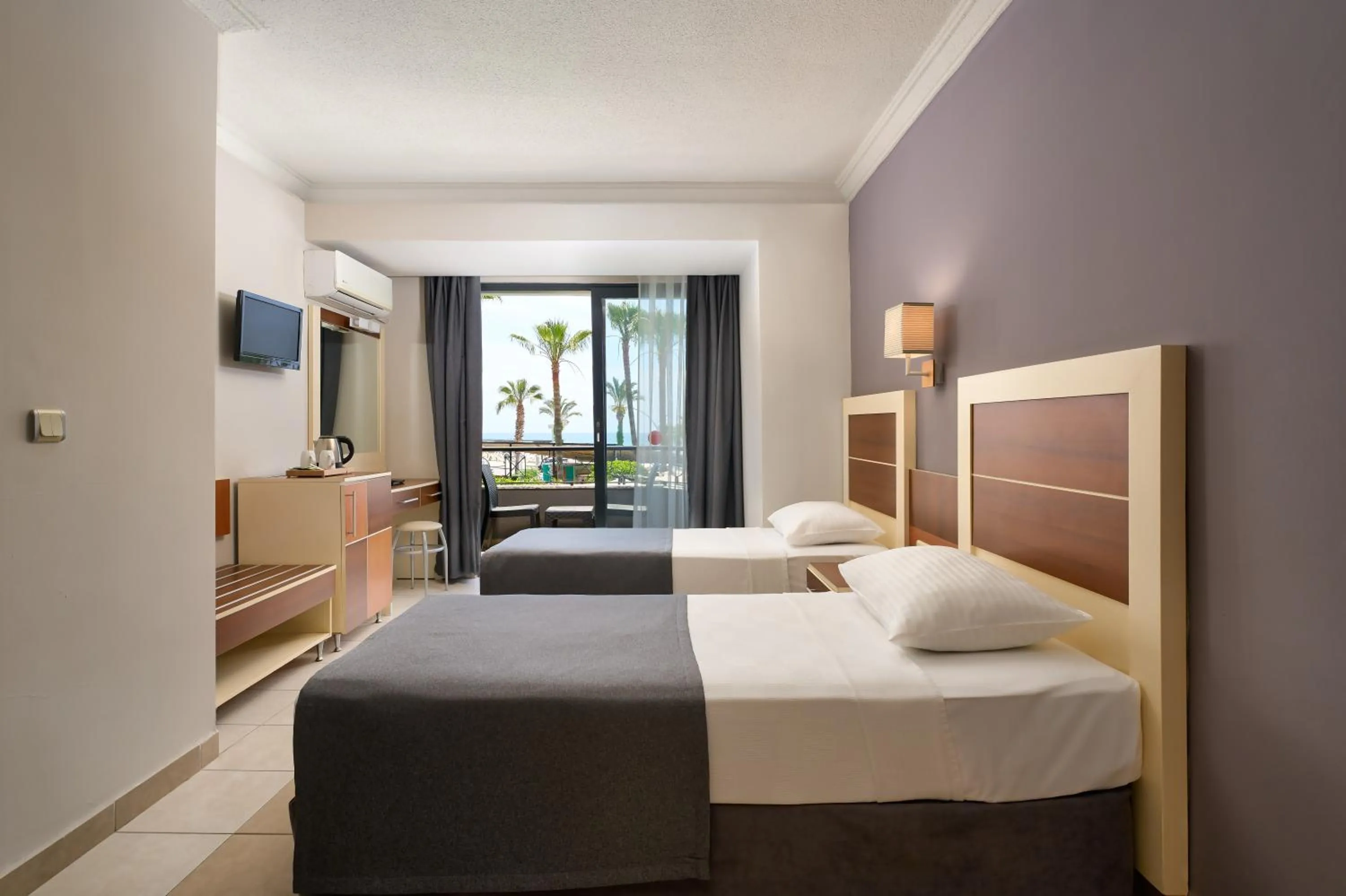 TV and multimedia, Bed in Kaila Krizantem Hotel