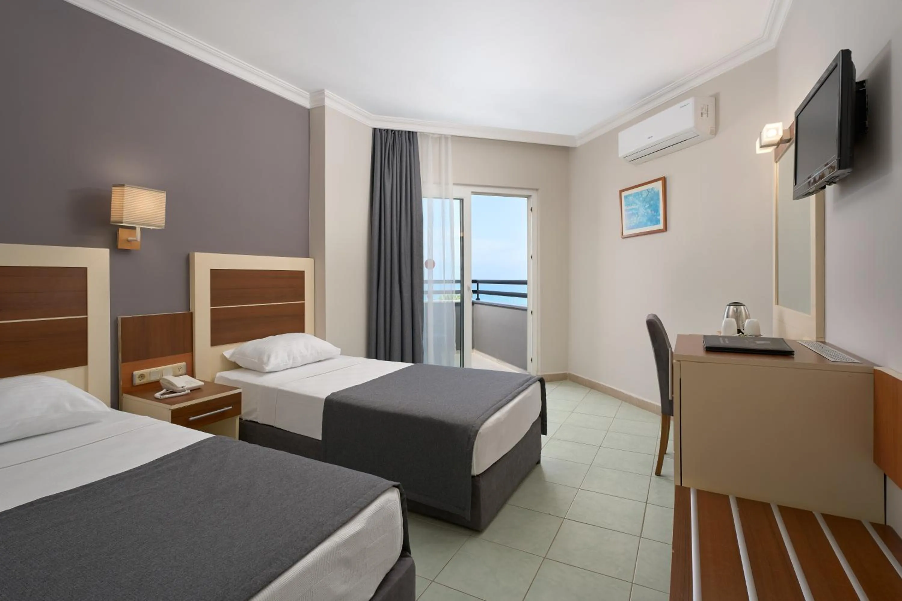 TV and multimedia, Bed in Kaila Krizantem Hotel