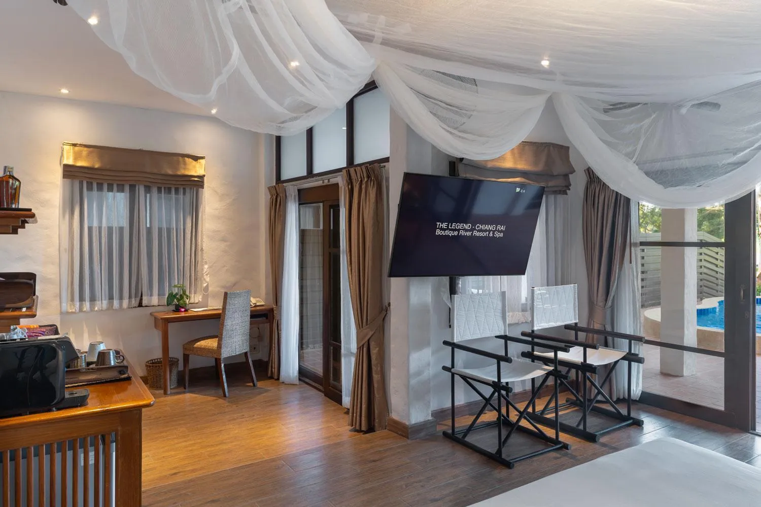 Communal lounge/ TV room in The Legend Chiang Rai Boutique River Resort & Spa