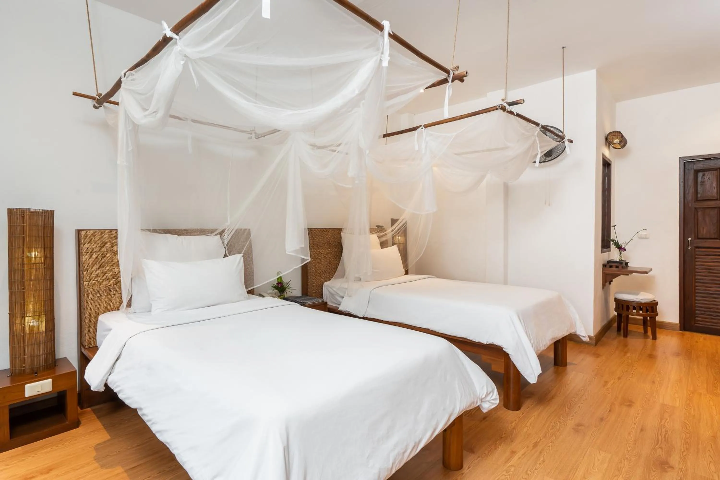 Bed in The Legend Chiang Rai Boutique River Resort & Spa