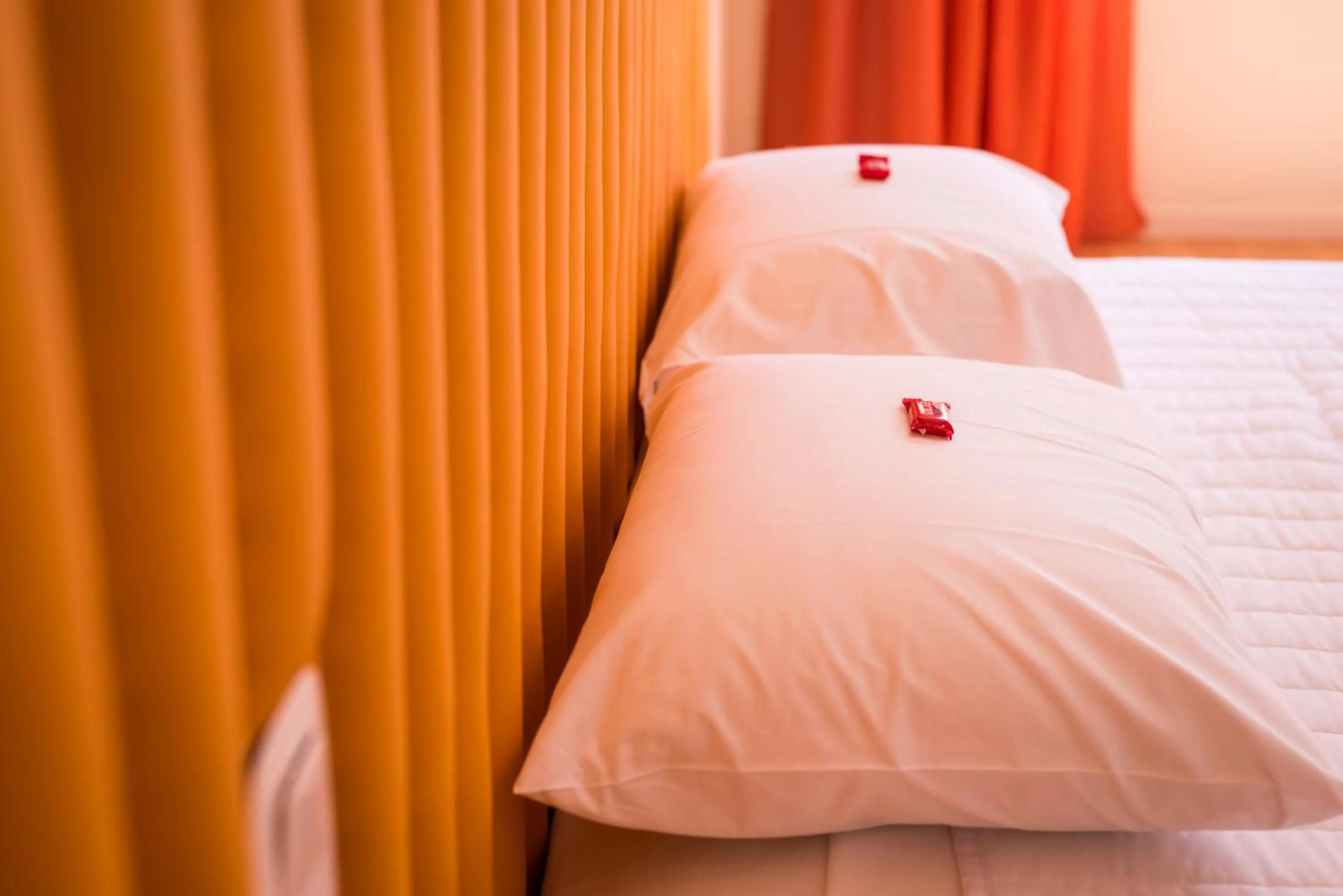 Bed in TheJoy City Suites