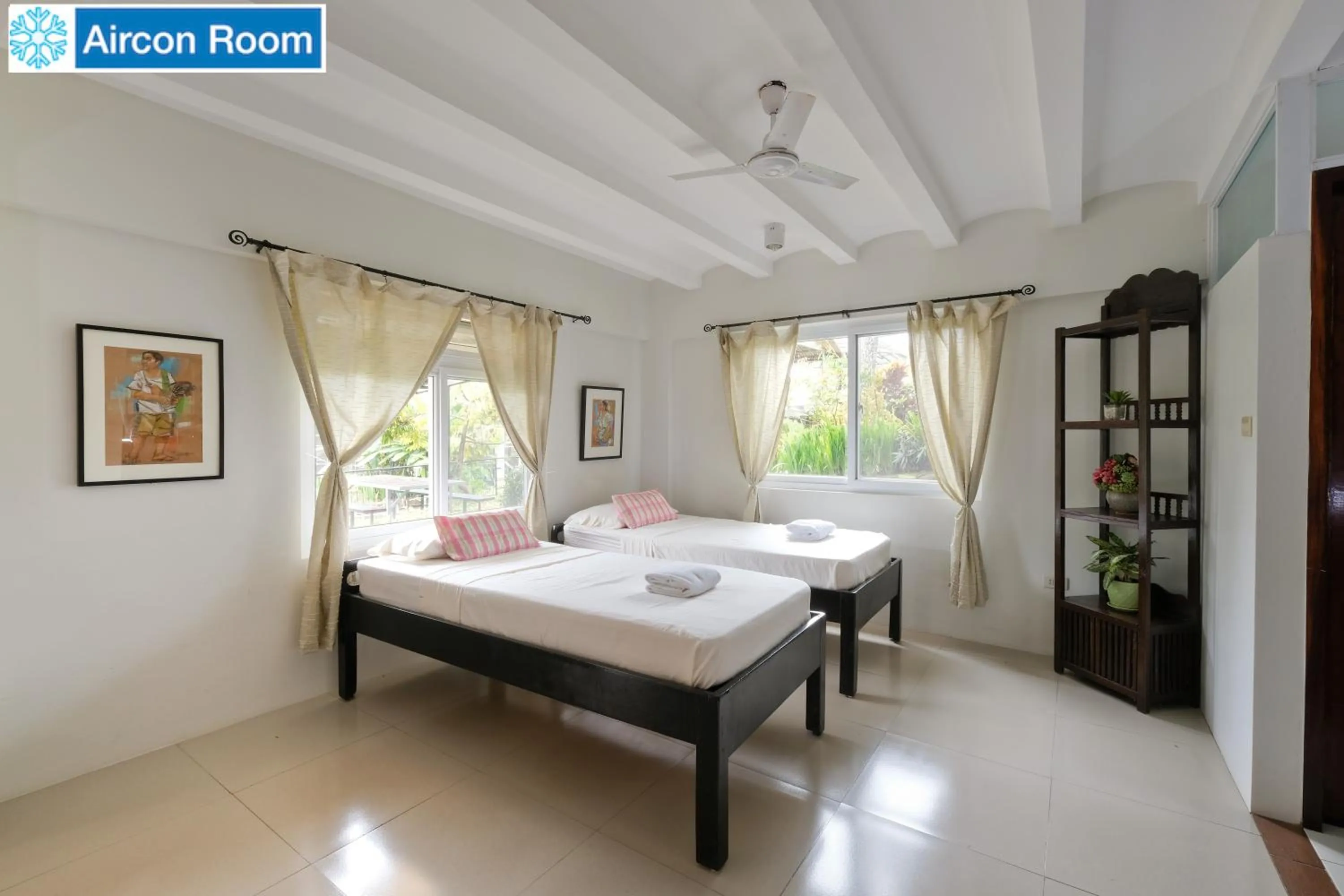 Bed in The Duyan House at Sinagtala Resort