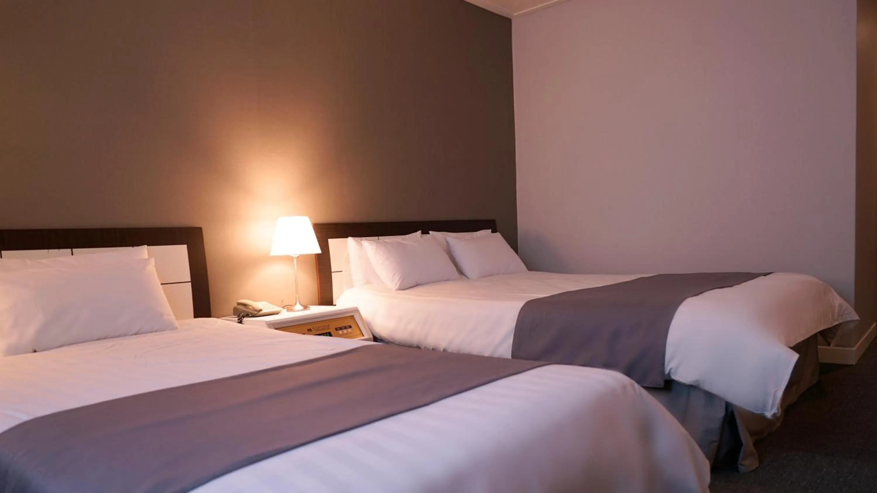 Bed in Pearl Hotel Jeju