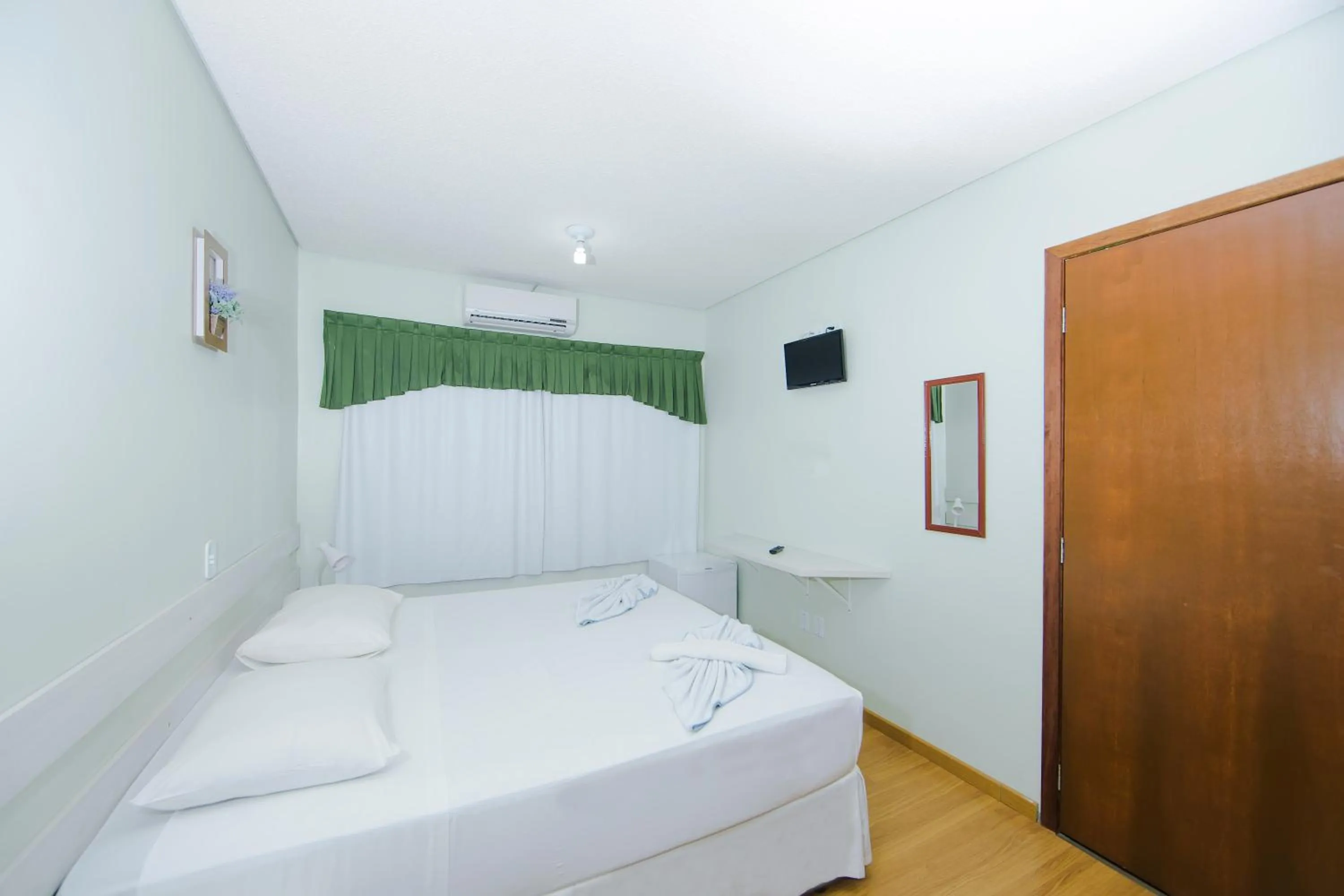 Decorative detail, Bed in Hotel e Pousada Caroline