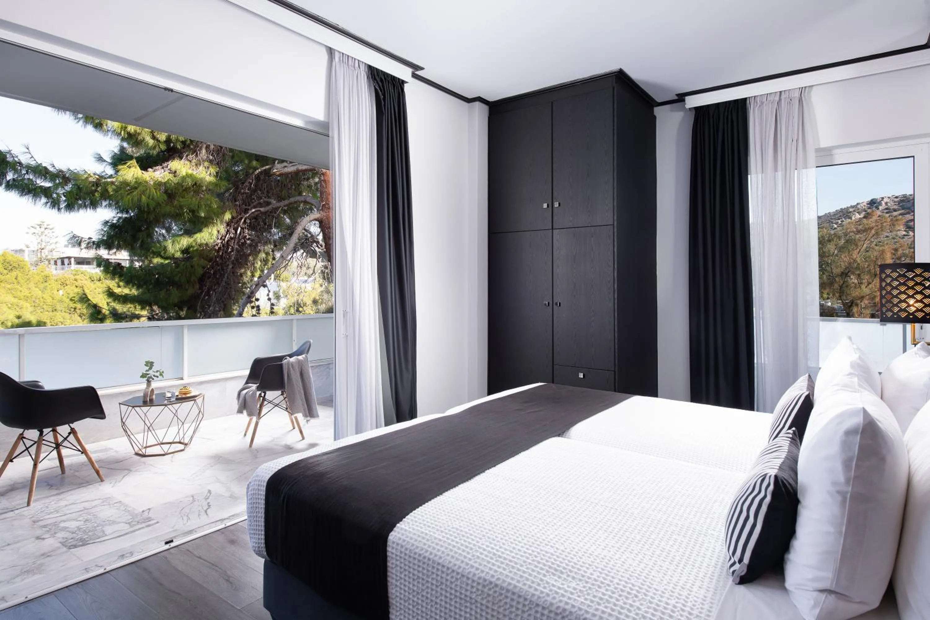 Bed in Athenian Riviera Hotel& Suites