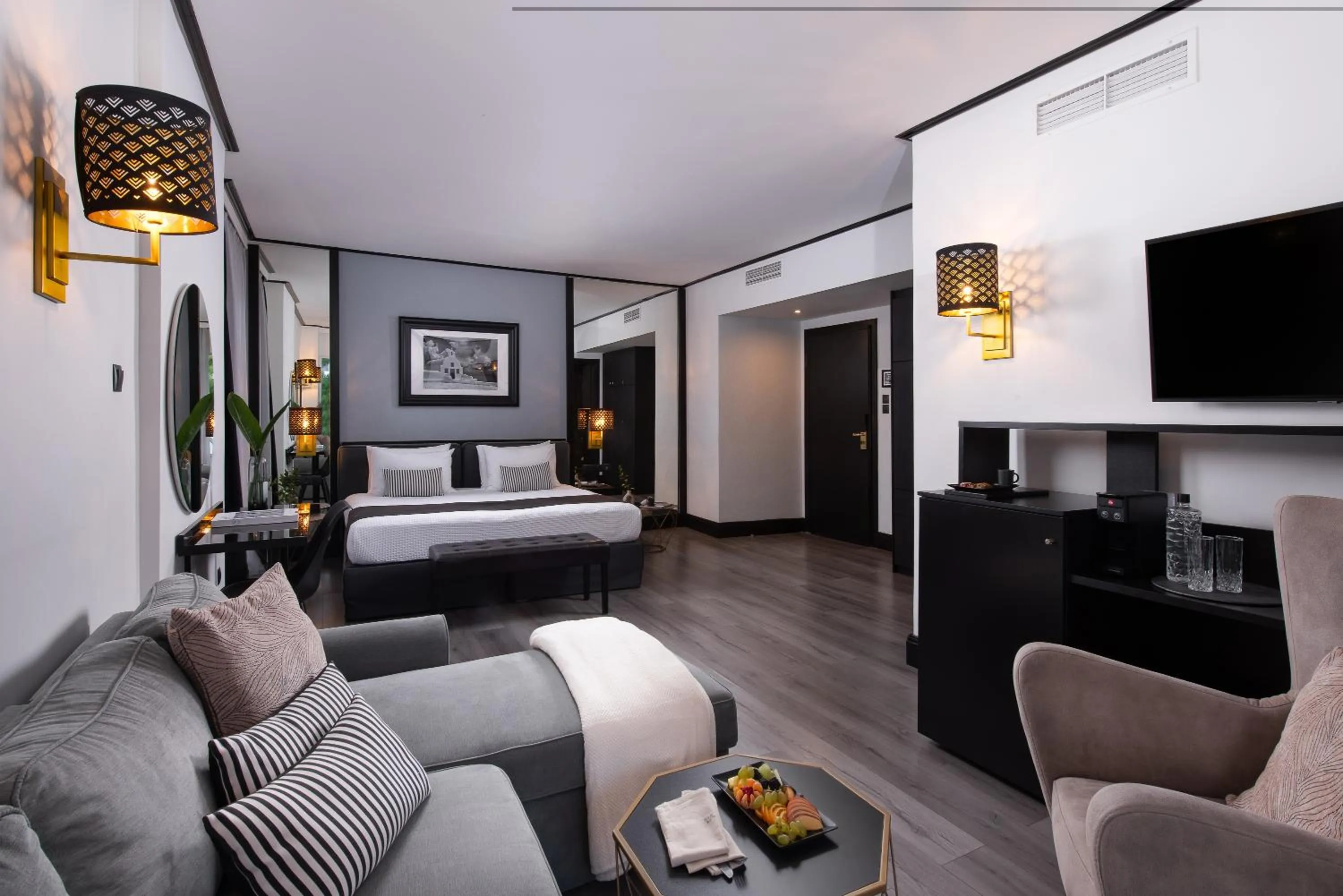 Seating area, Bed in Athenian Riviera Hotel& Suites