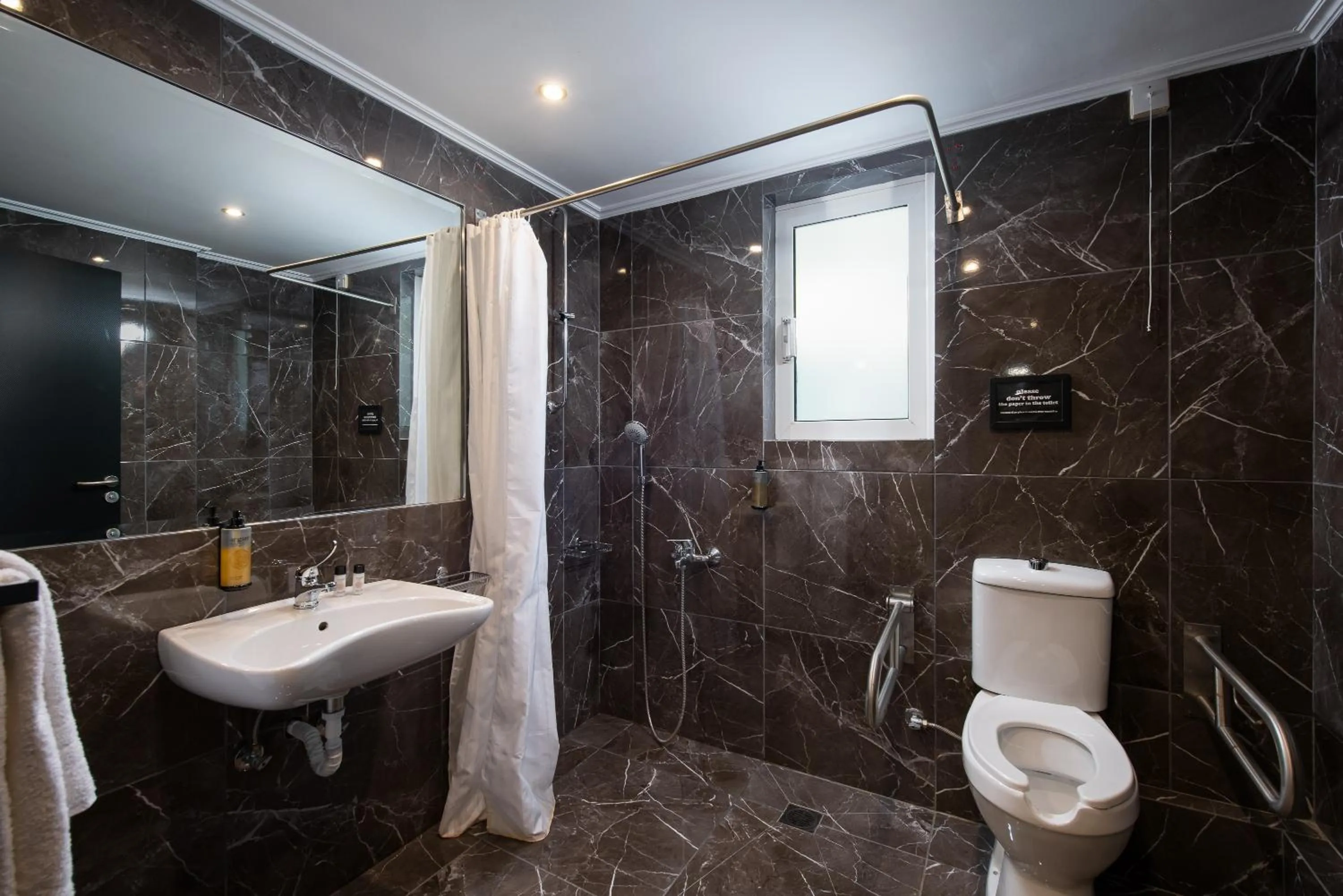 Bathroom in Athenian Riviera Hotel& Suites