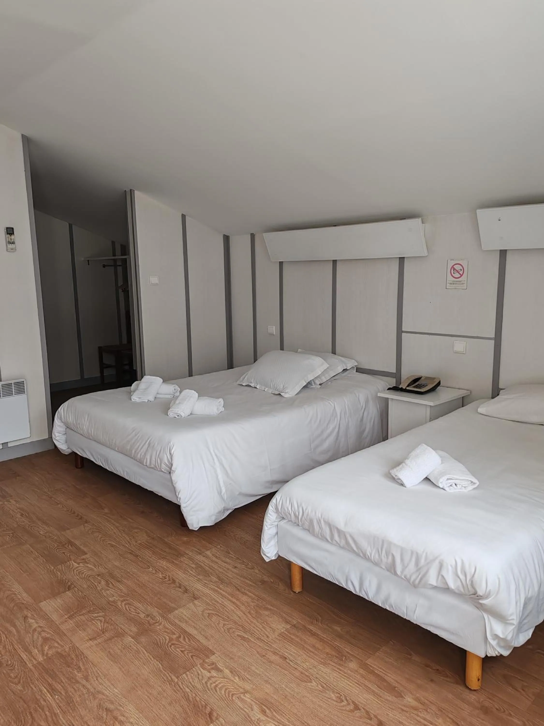 Bed in Hotel Marjolaine