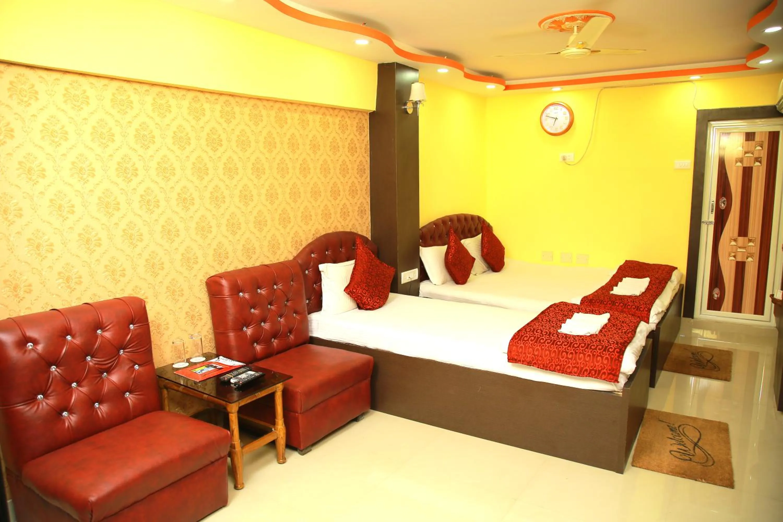Seating area, Bed in Babul Hotel