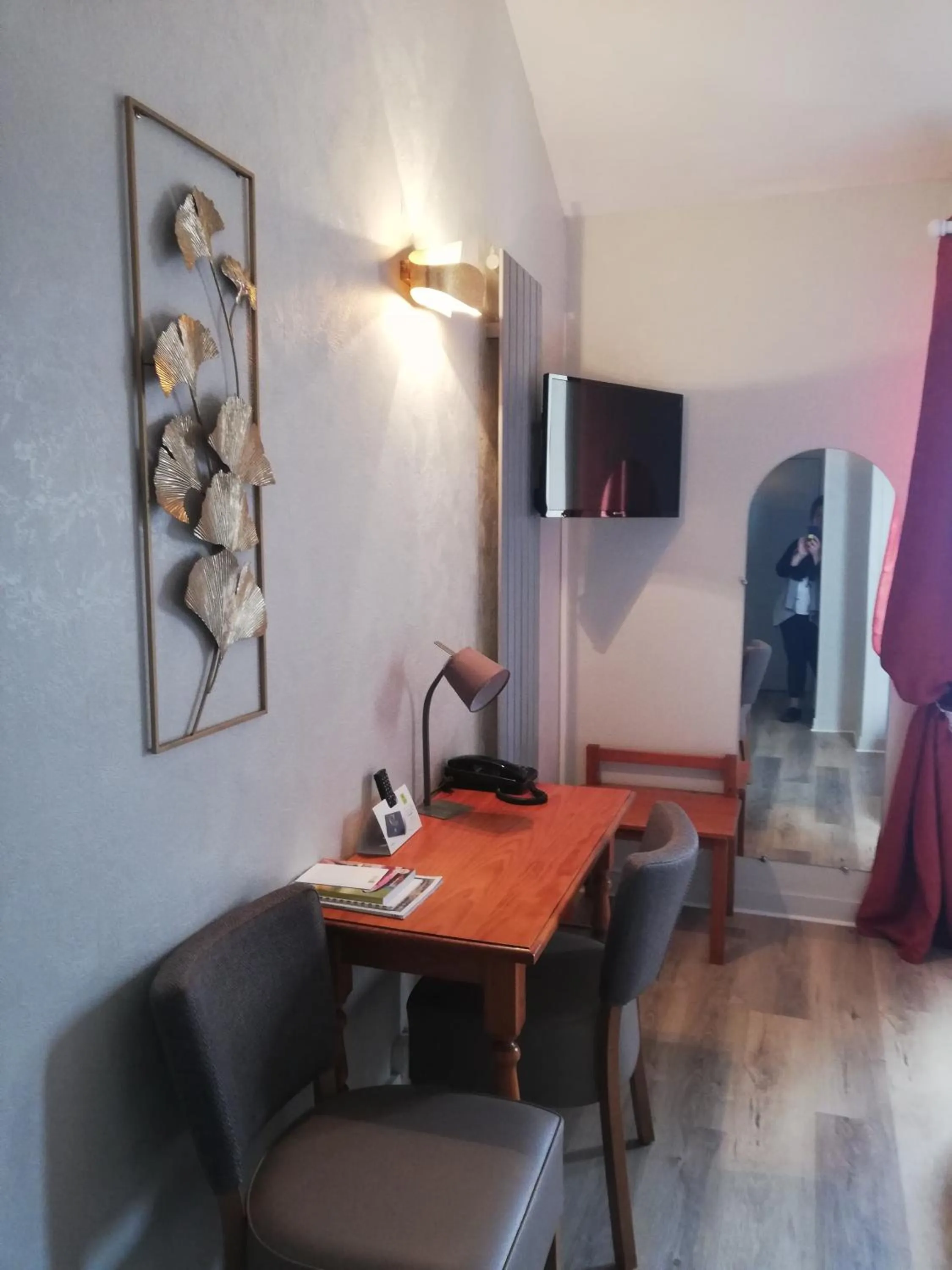 Seating area in Logis Hotel Restaurant l'Orée Des Bois