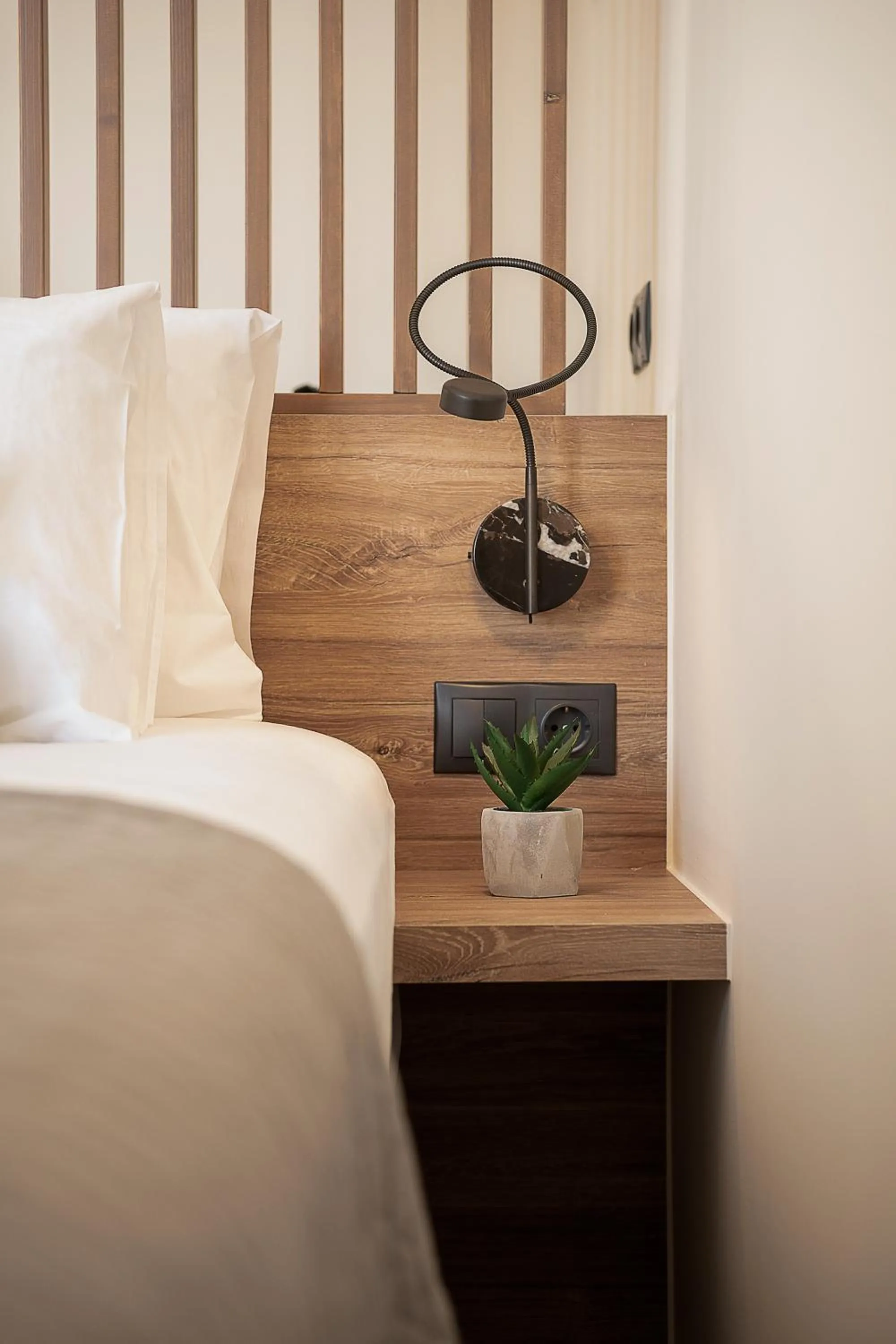 Bed in Amphitrite Hotel