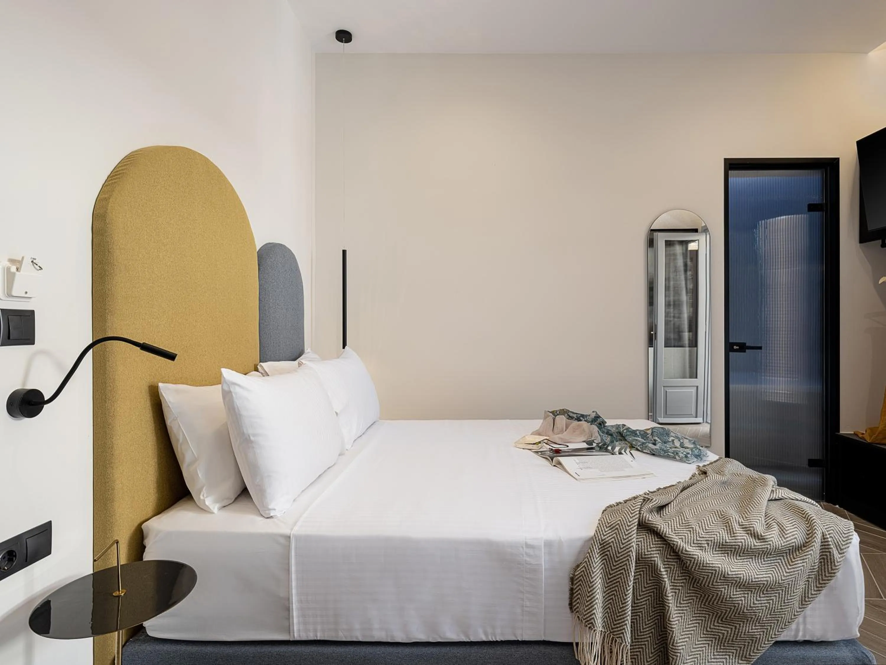 Bed in Amphitrite Hotel