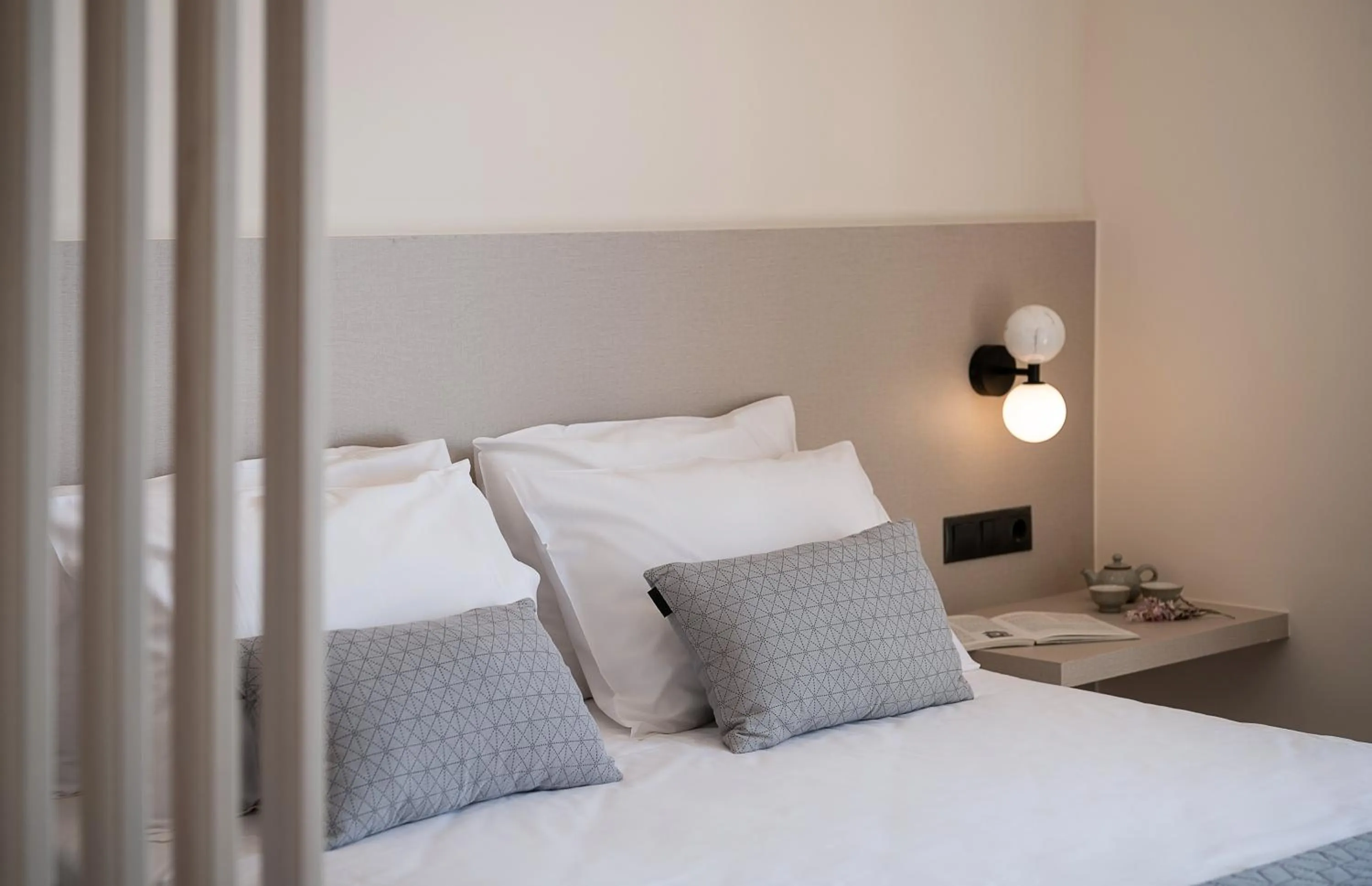 Bed in Amphitrite Hotel