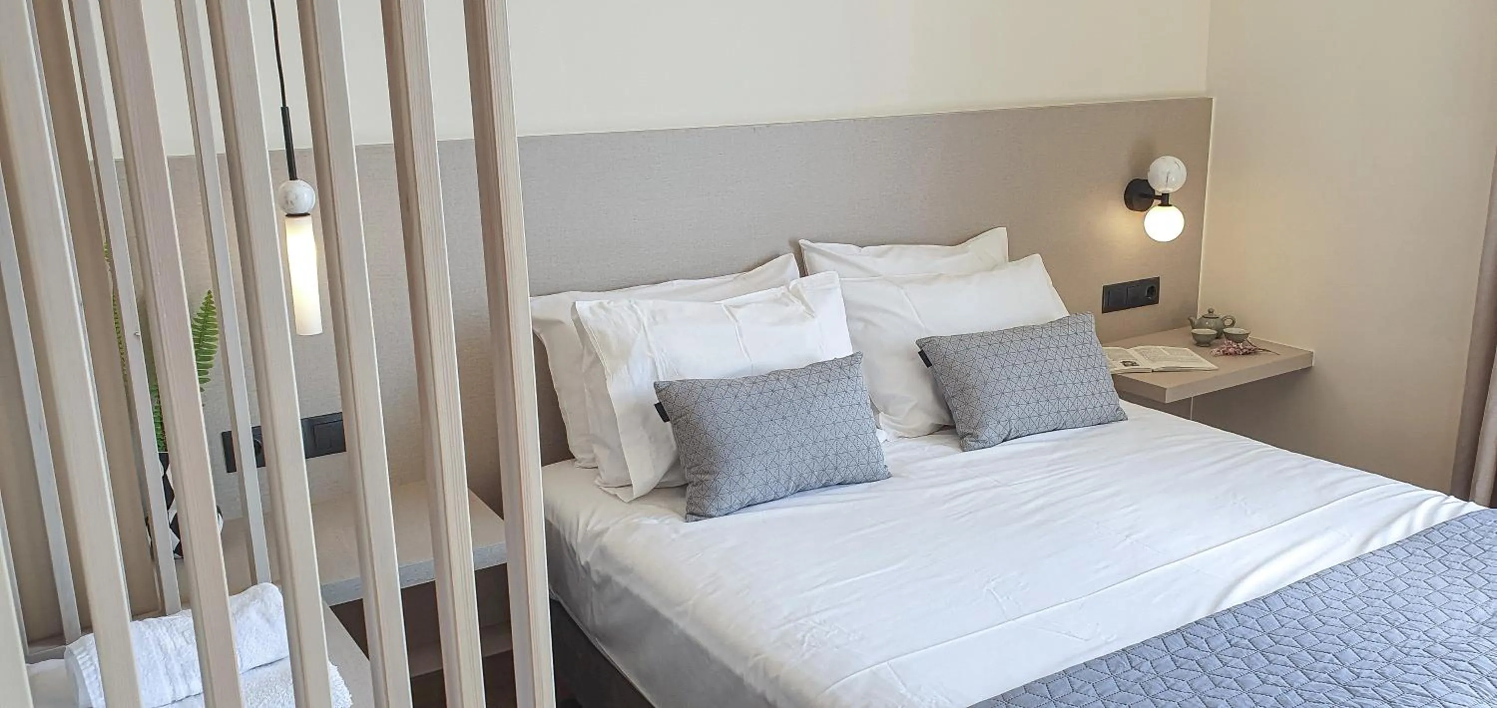 Bed in Amphitrite Hotel