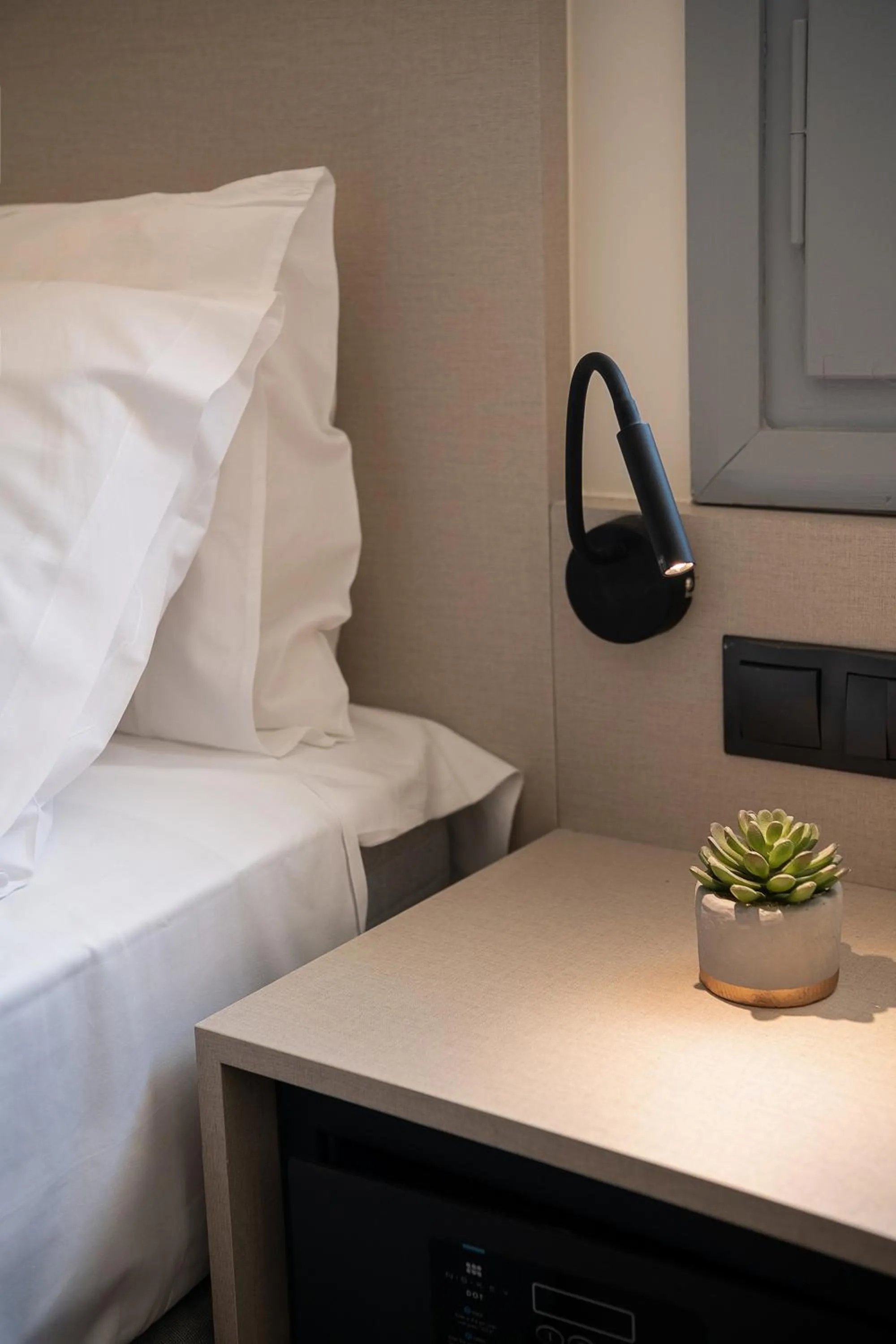 Bed in Amphitrite Hotel