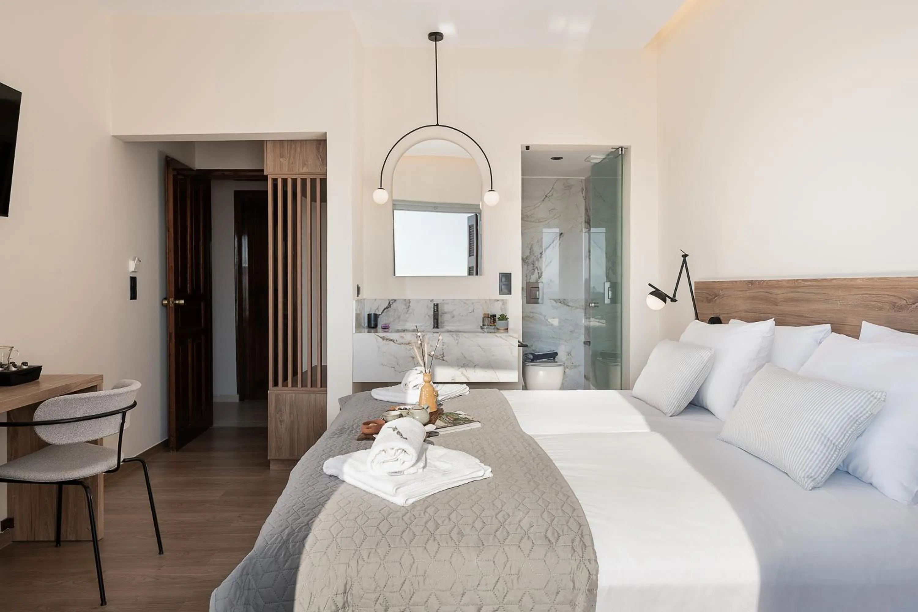 Bed in Amphitrite Hotel