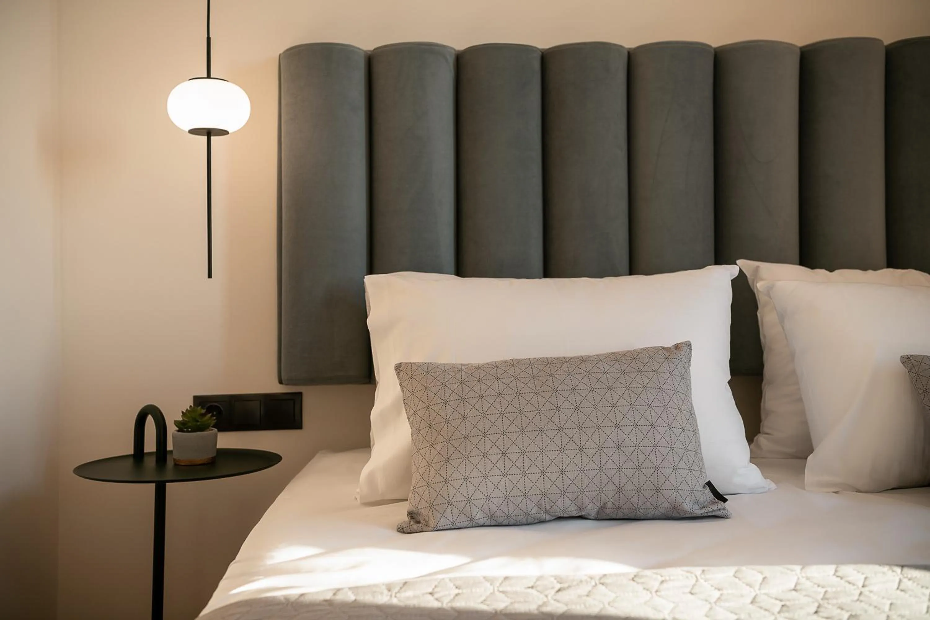 Bed in Amphitrite Hotel