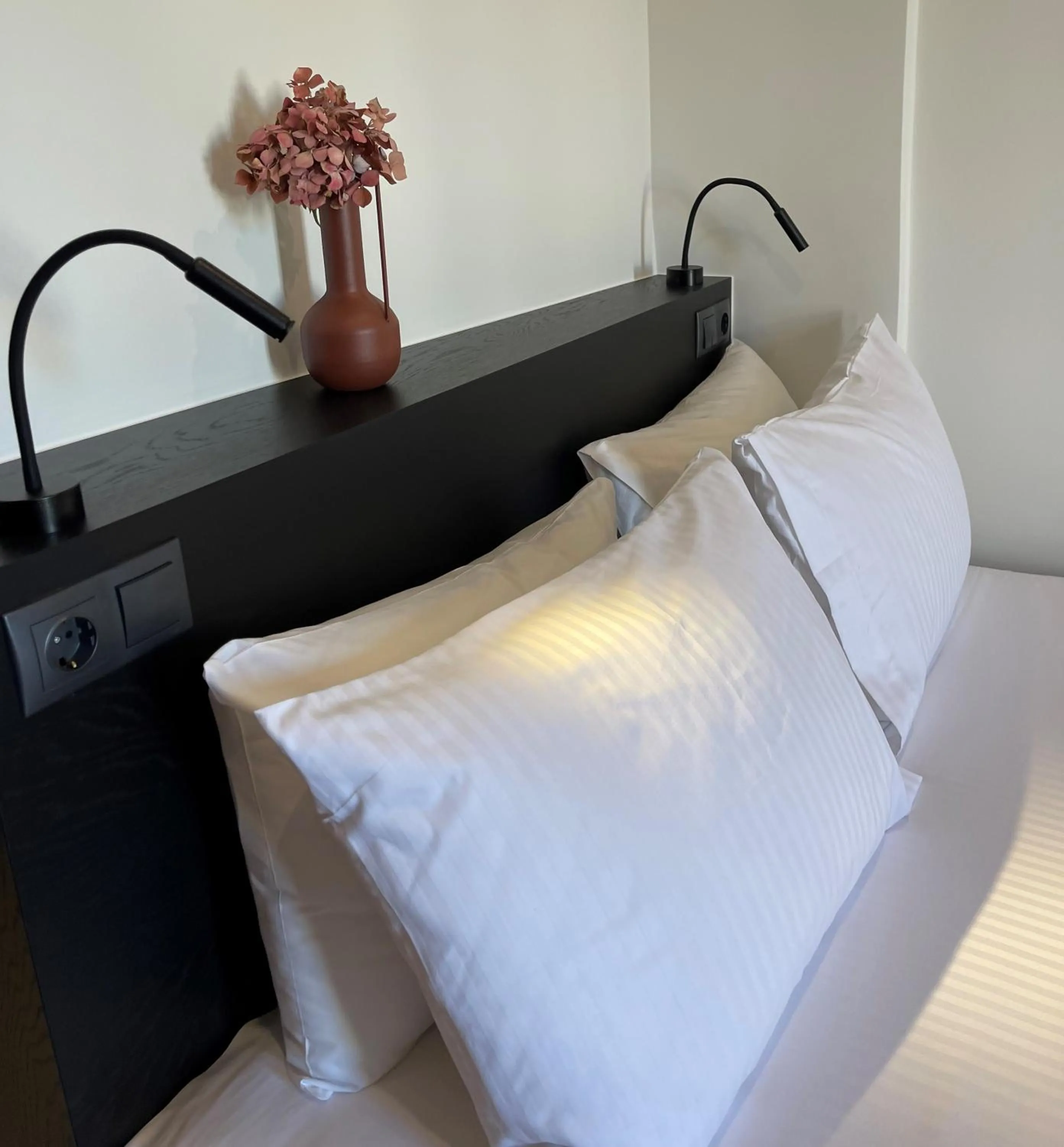 Bed in Amphitrite Hotel