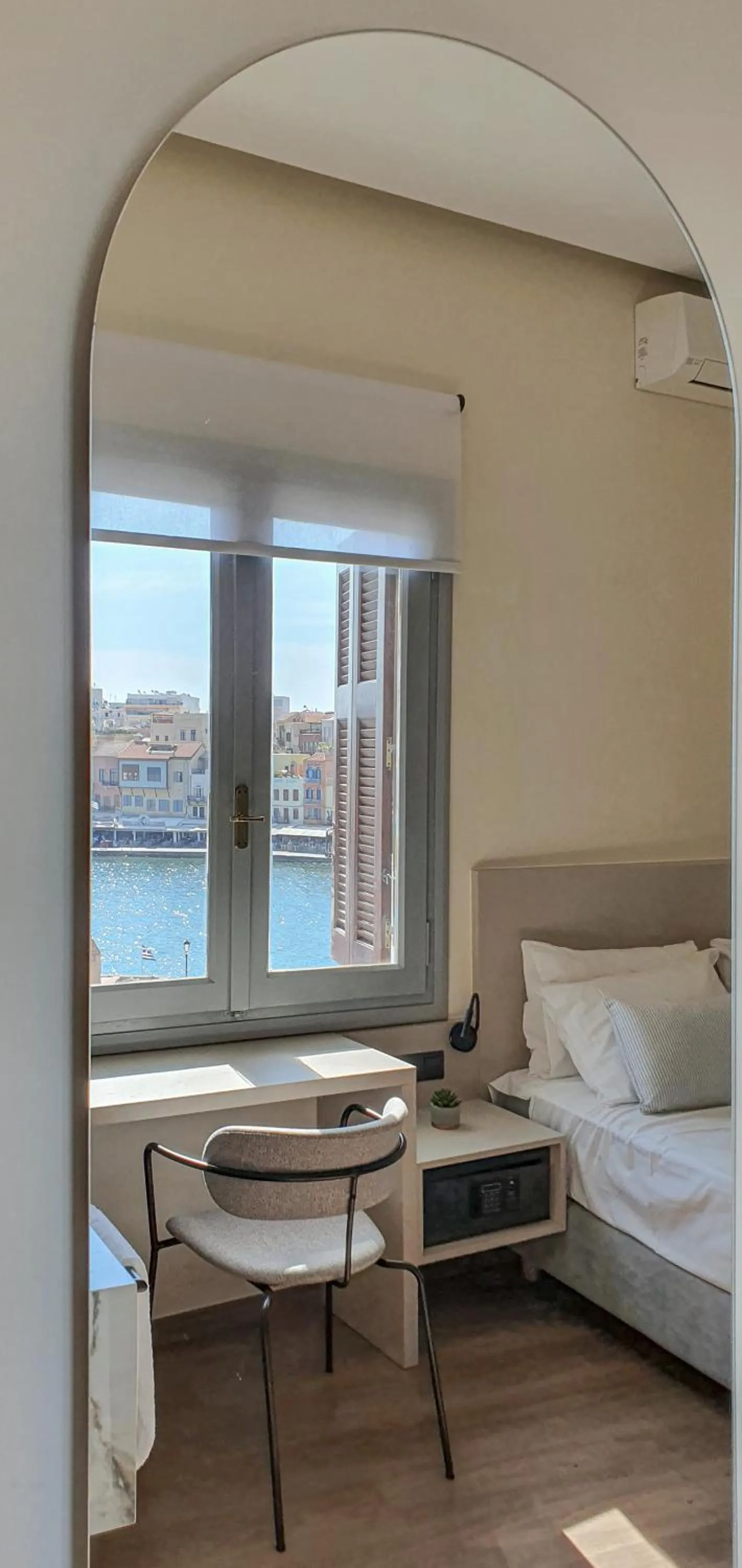 Seating area, Bed in Amphitrite Hotel