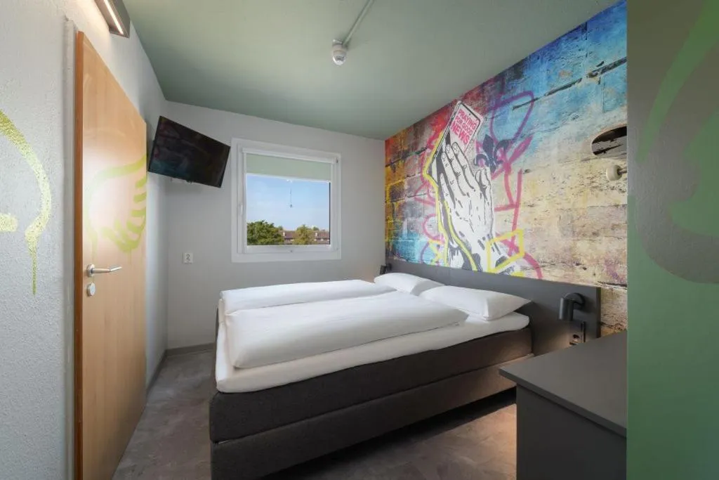 Bed in Felix Hotel Darmstadt