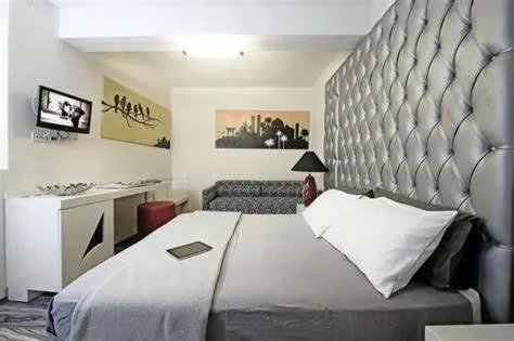Bed in Happy Hotel Atelier Gardone Riviera Centro & Spa