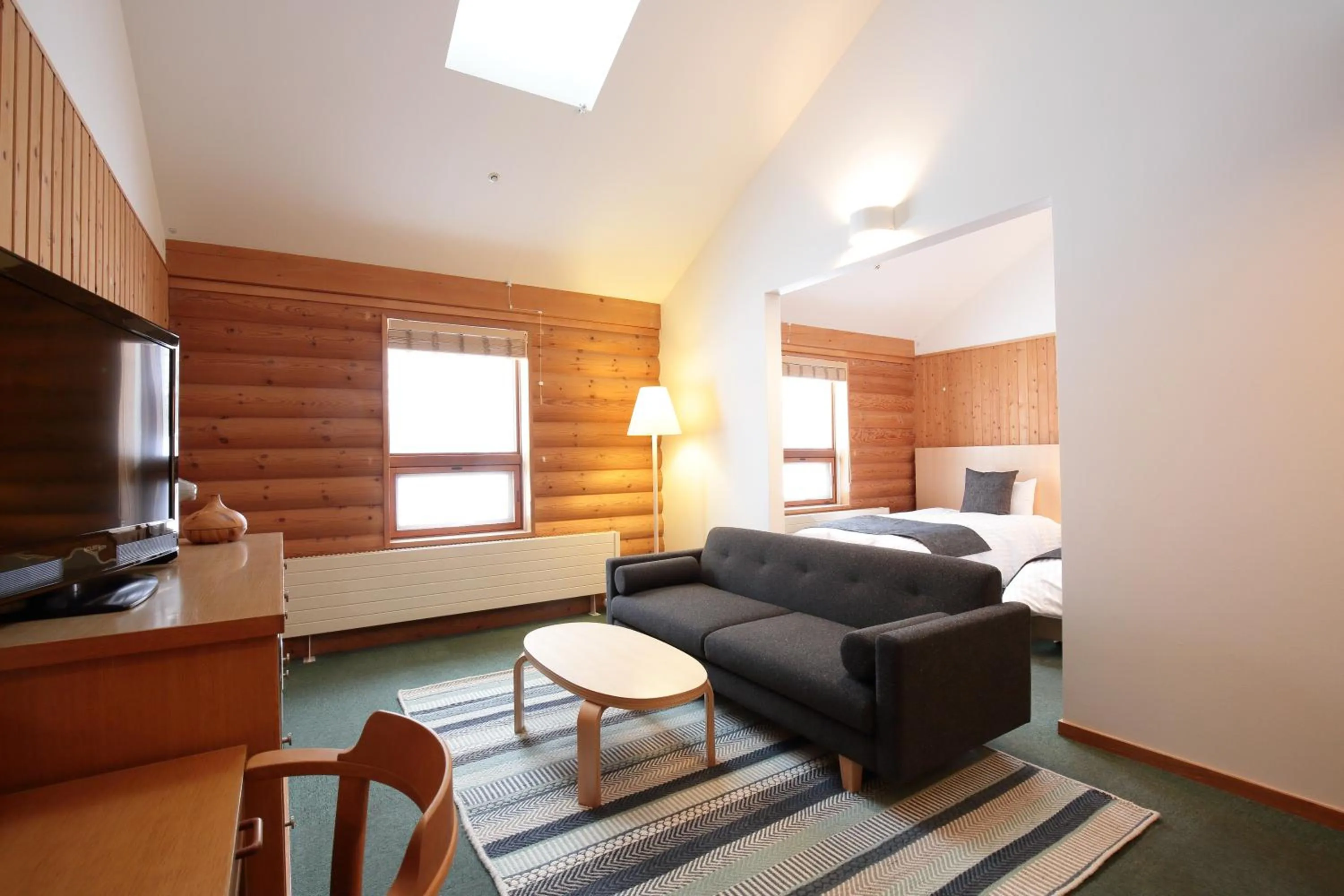 Bed in Log Hotel The Maple Lodge