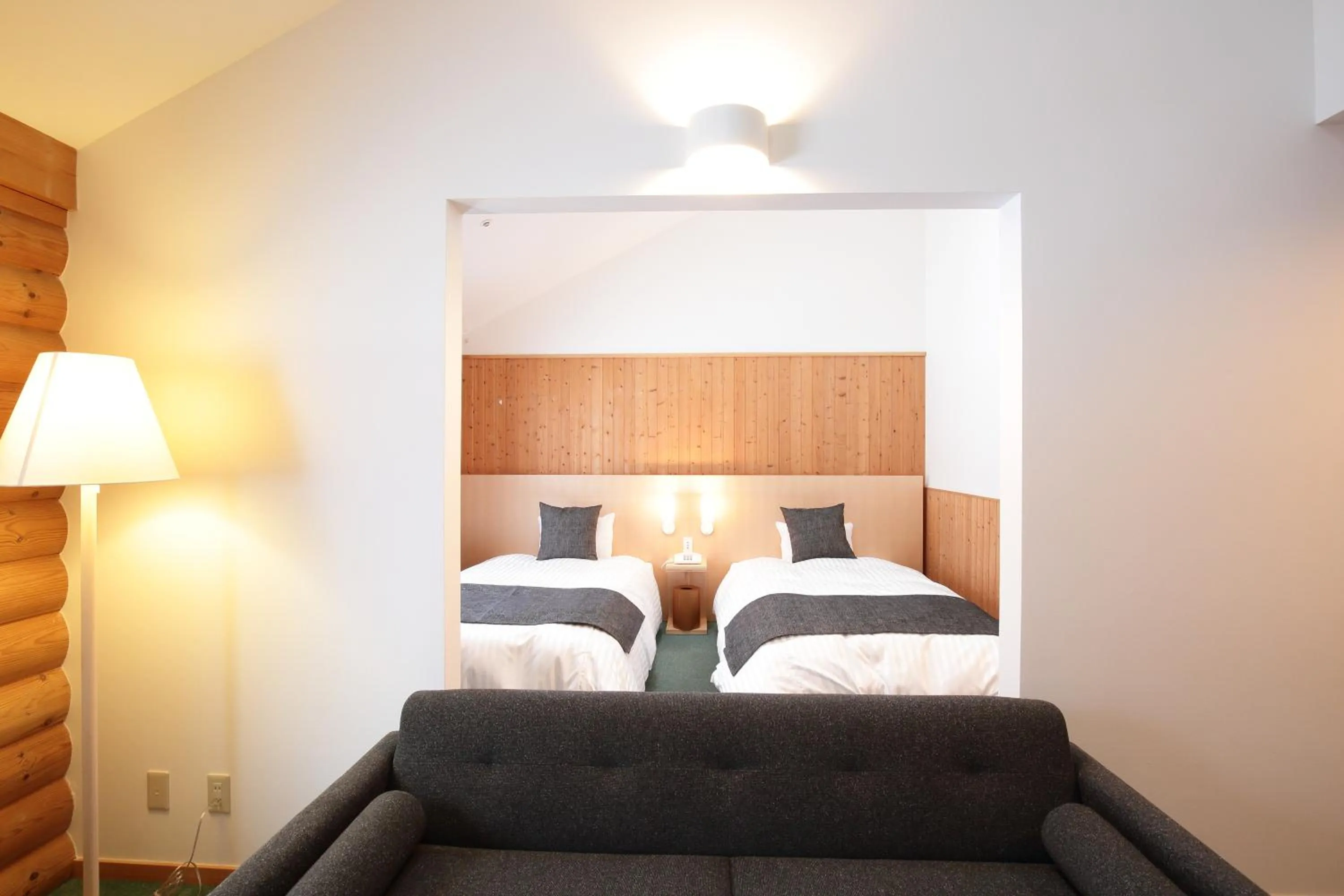 Bed in Log Hotel The Maple Lodge