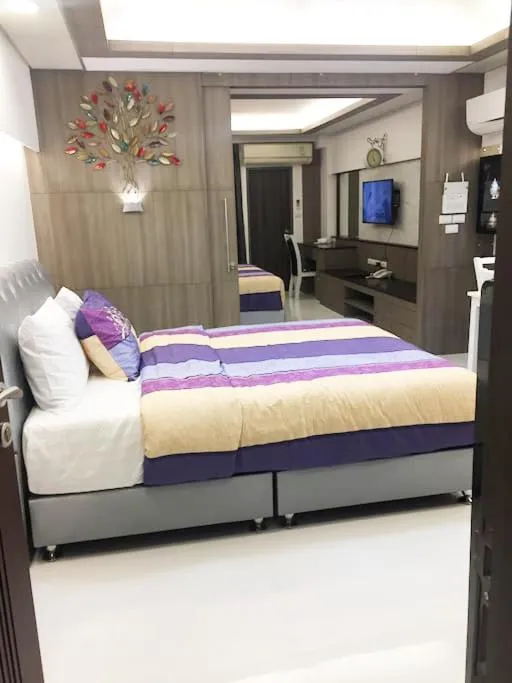 Property building, Bed in Family Suite Room Pratunam