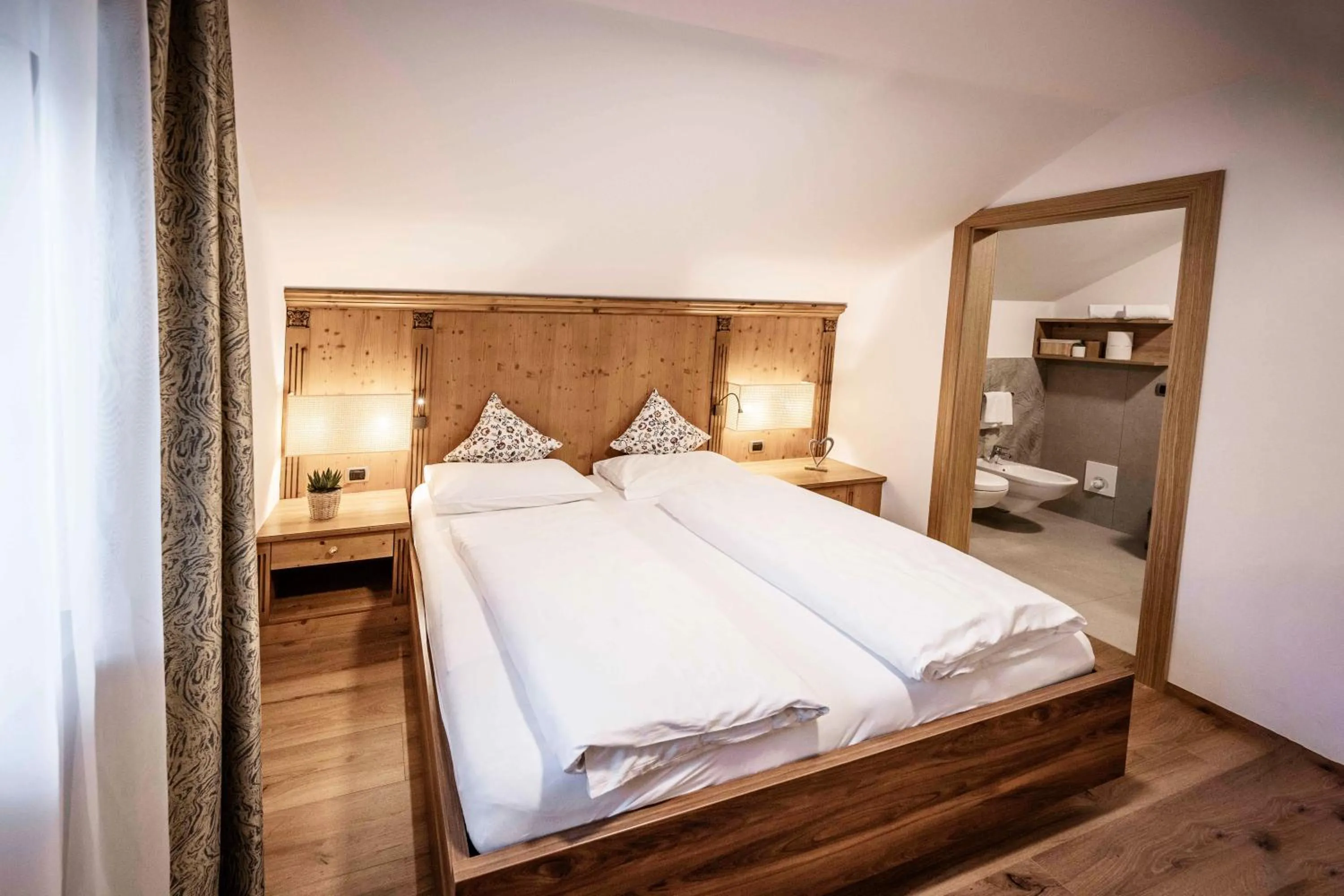 Bed in Active Hotel Sonne