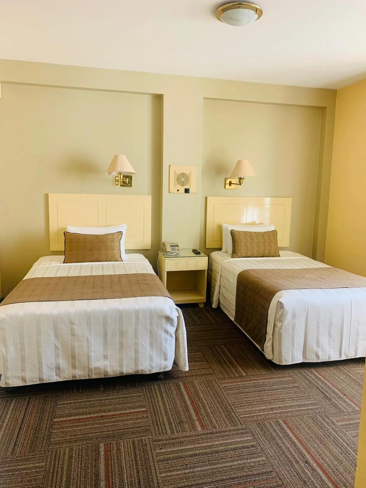 Bed in Embajadores Hotel