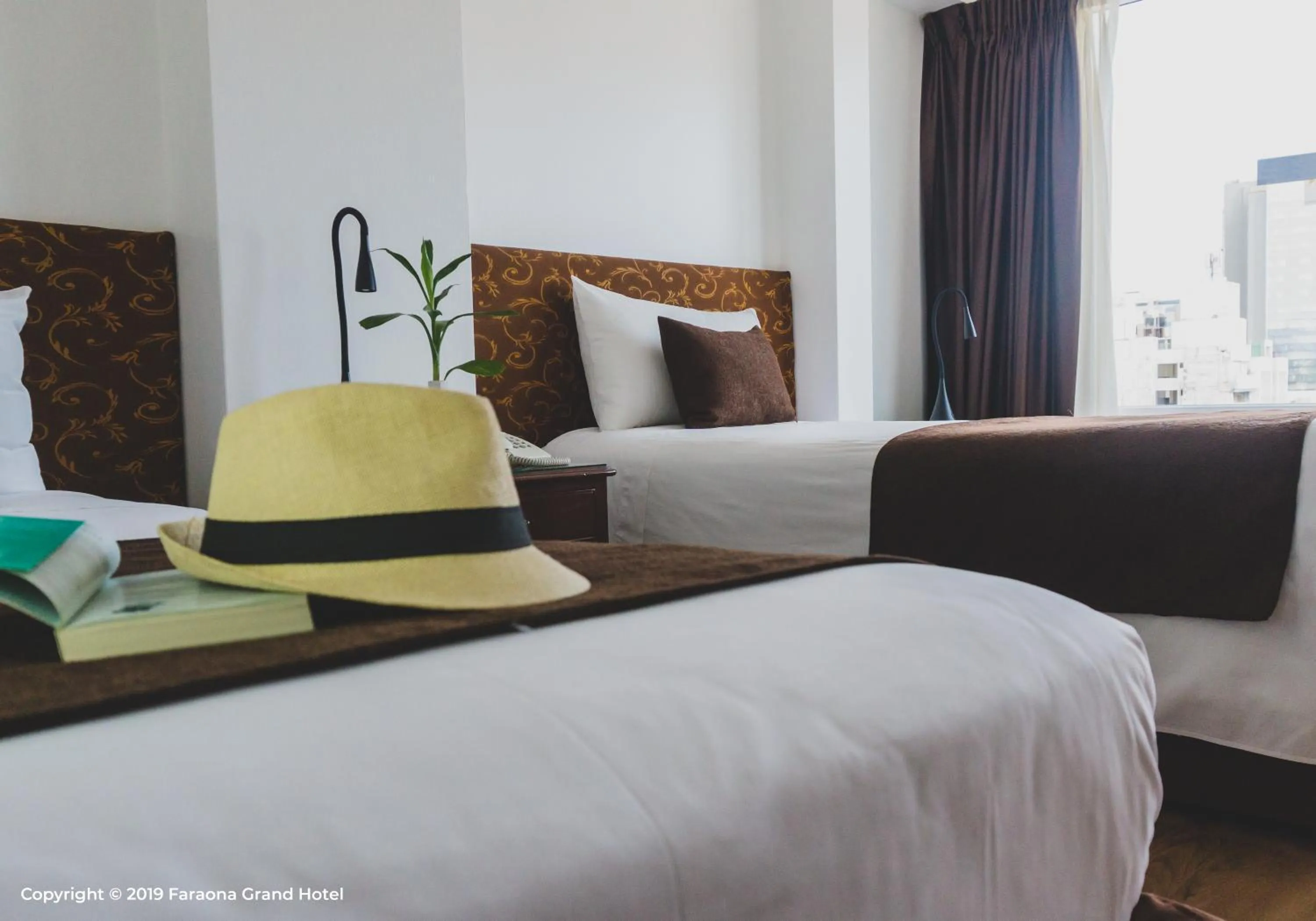 Bed in Faraona Grand Hotel