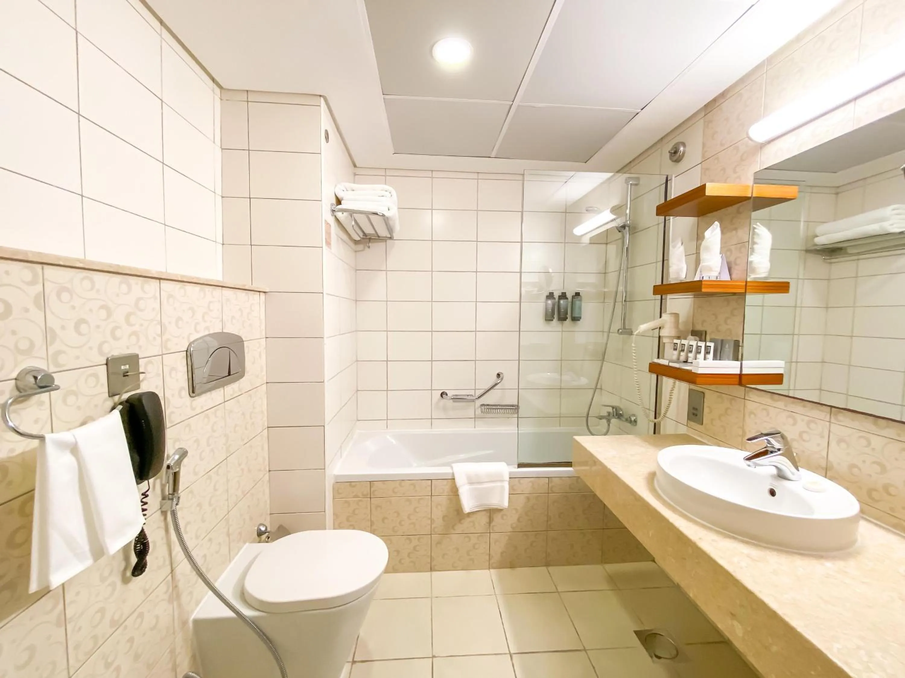 Bathroom in City Seasons Al Hamra Hotel