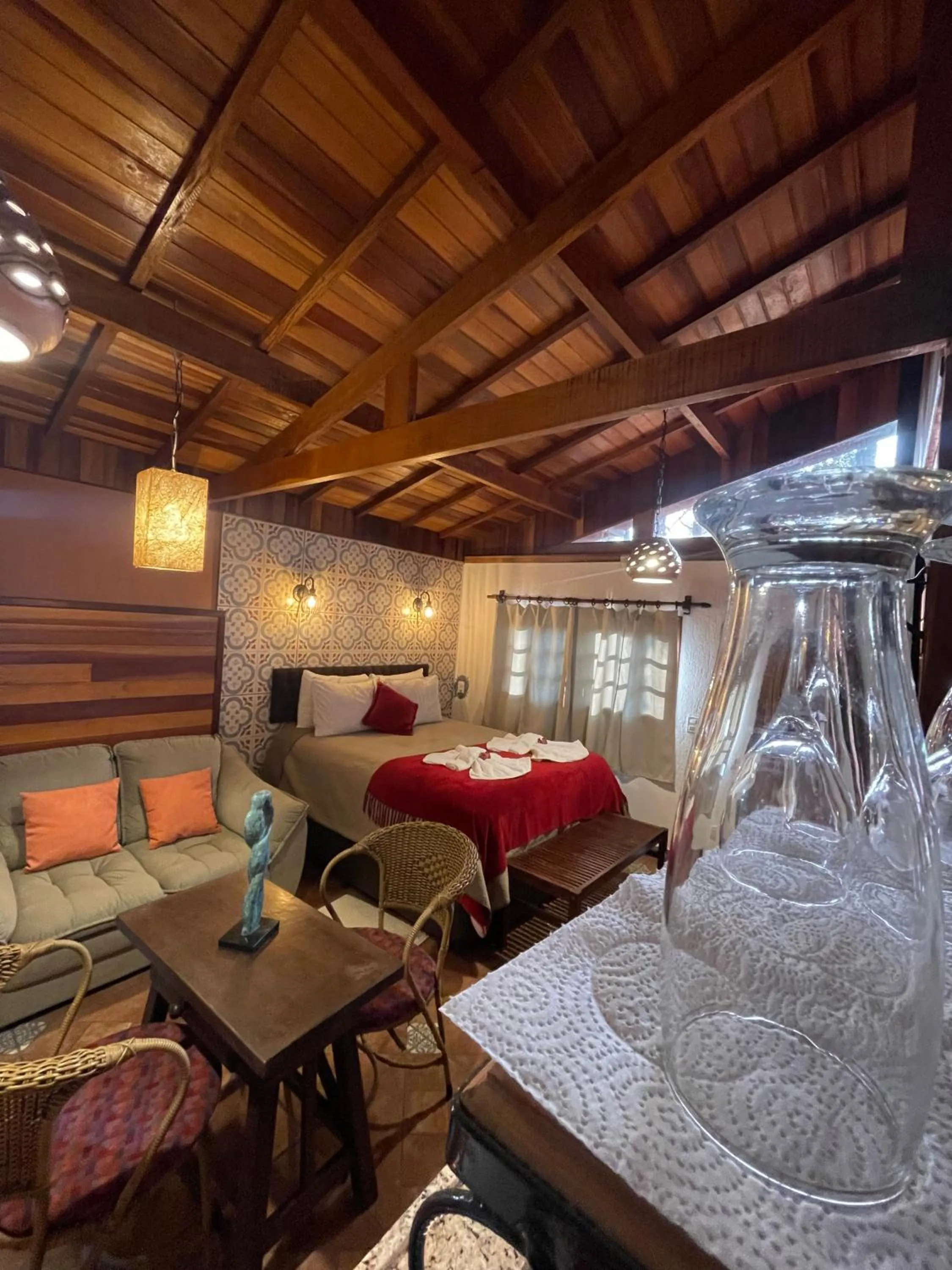 Seating area, Bed in Chalés ANECUEM