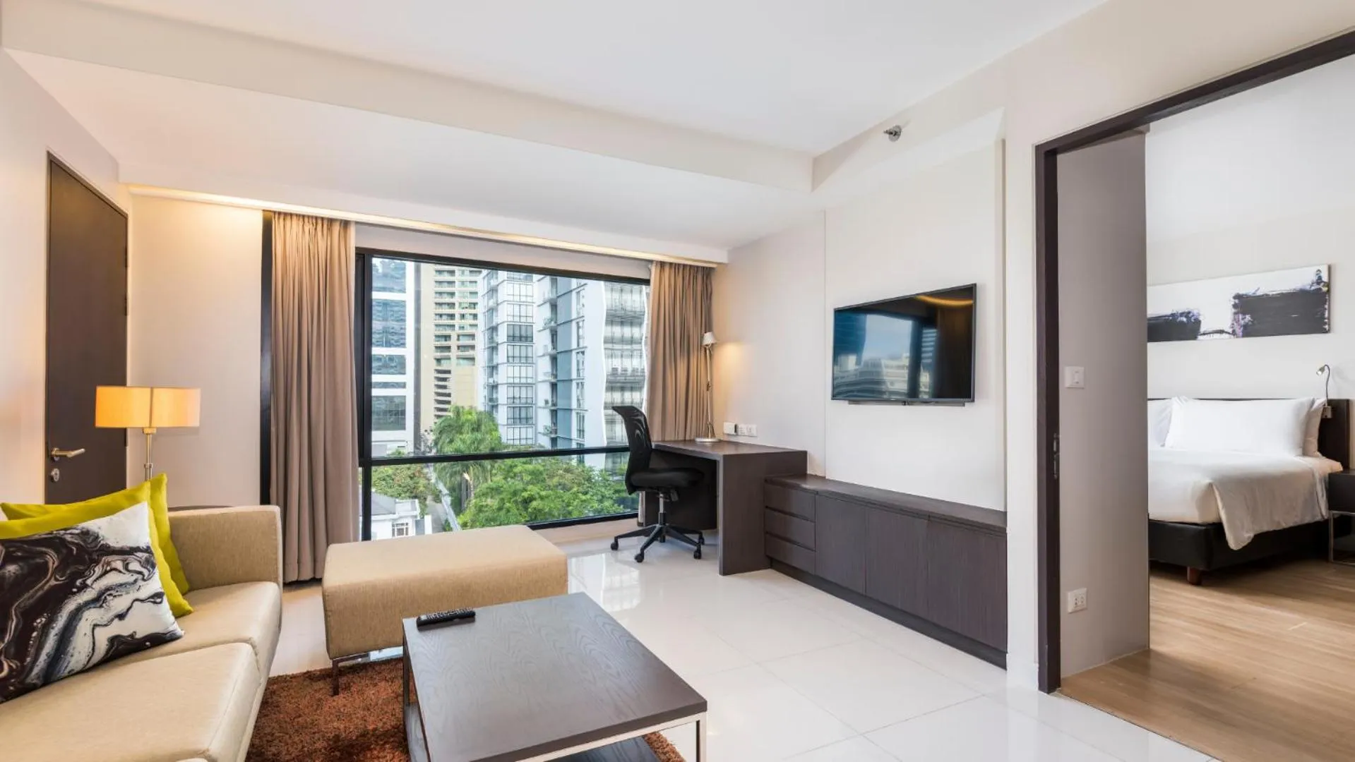 Living room, Bed in Maitria Hotel Sukhumvit 18 Bangkok – A Chatrium Collection