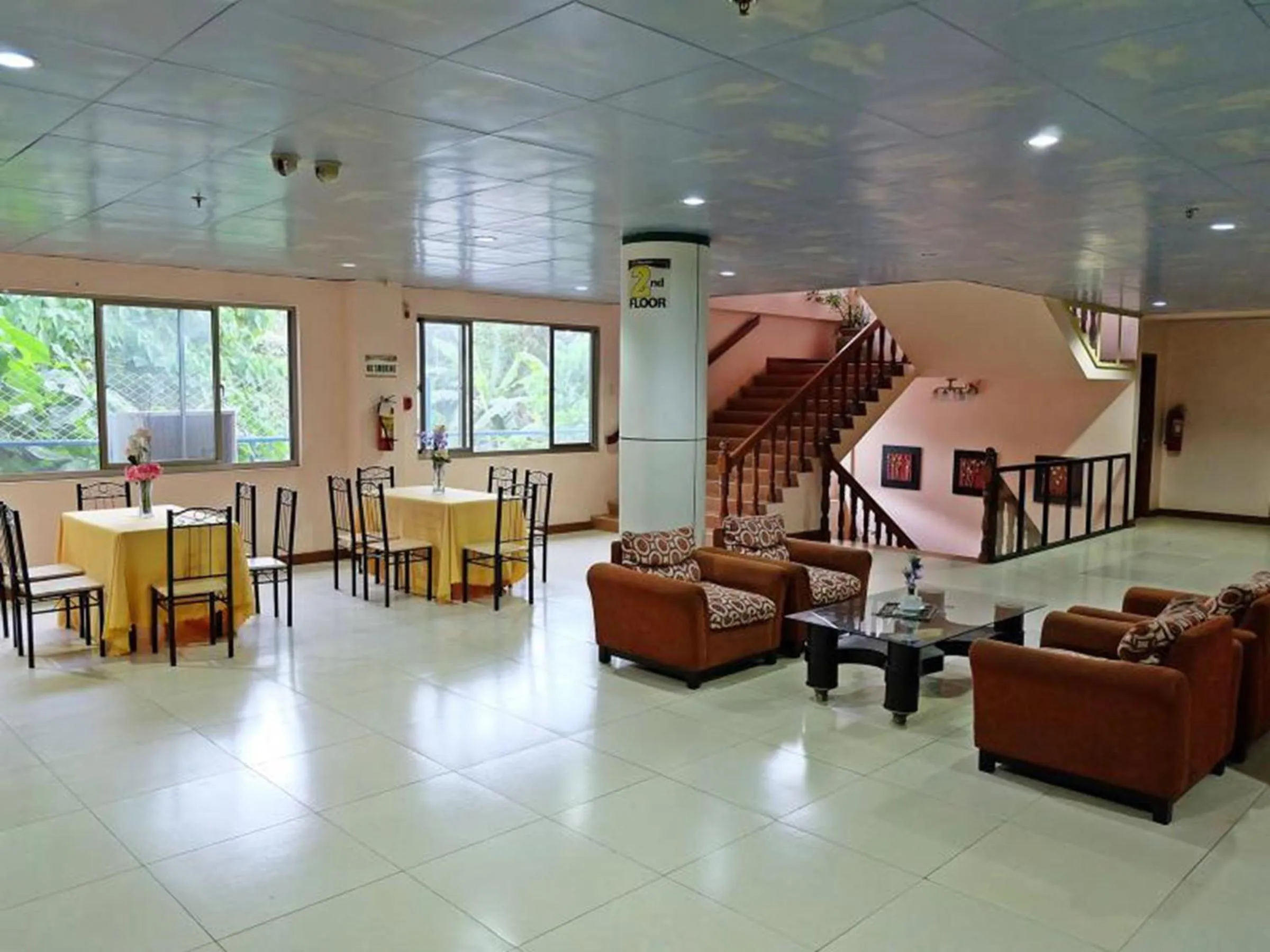 Communal lounge/ TV room in A&A Plaza Hotel