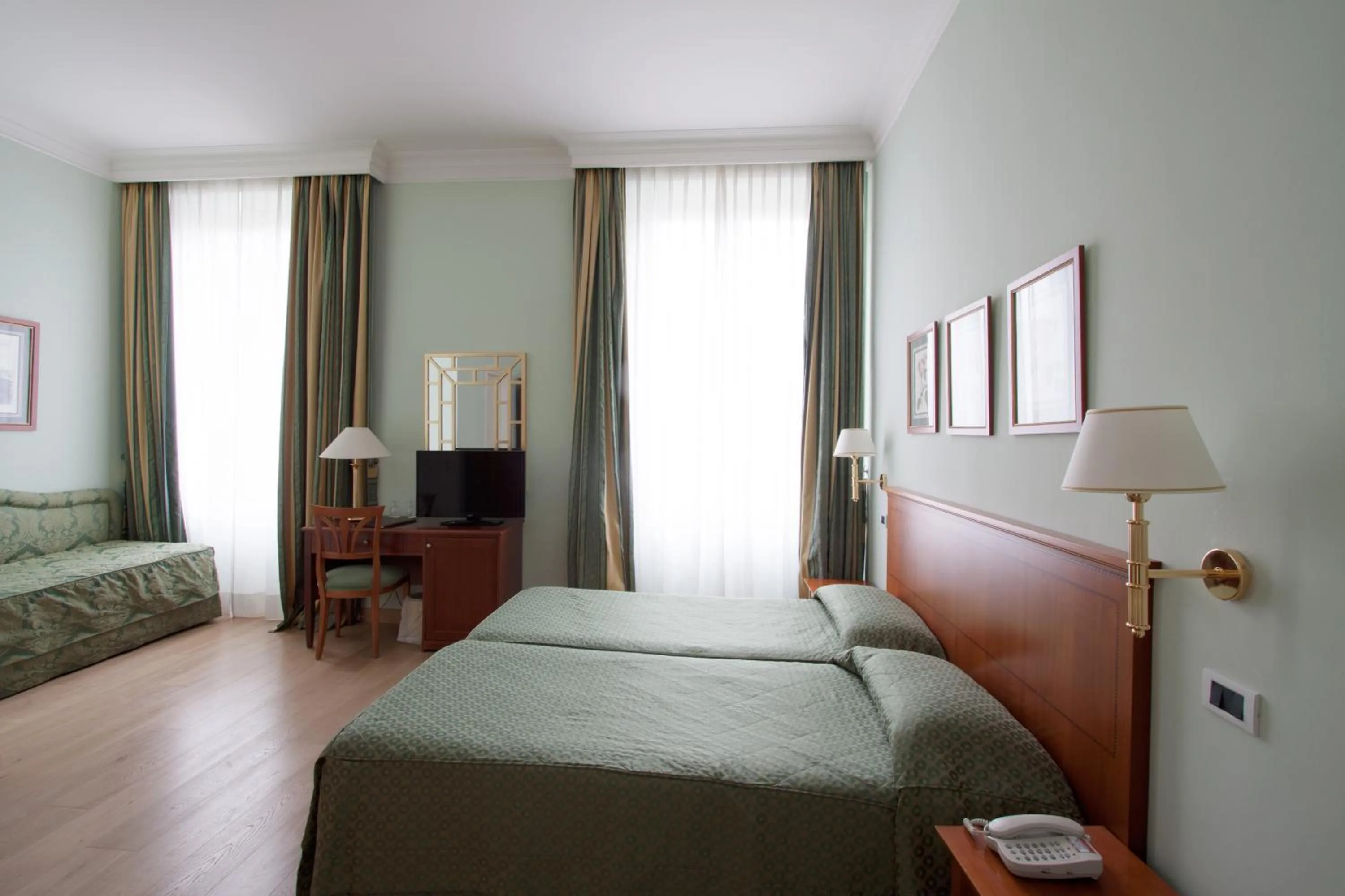 Photo of the whole room, Bed in Ateneo Garden Palace