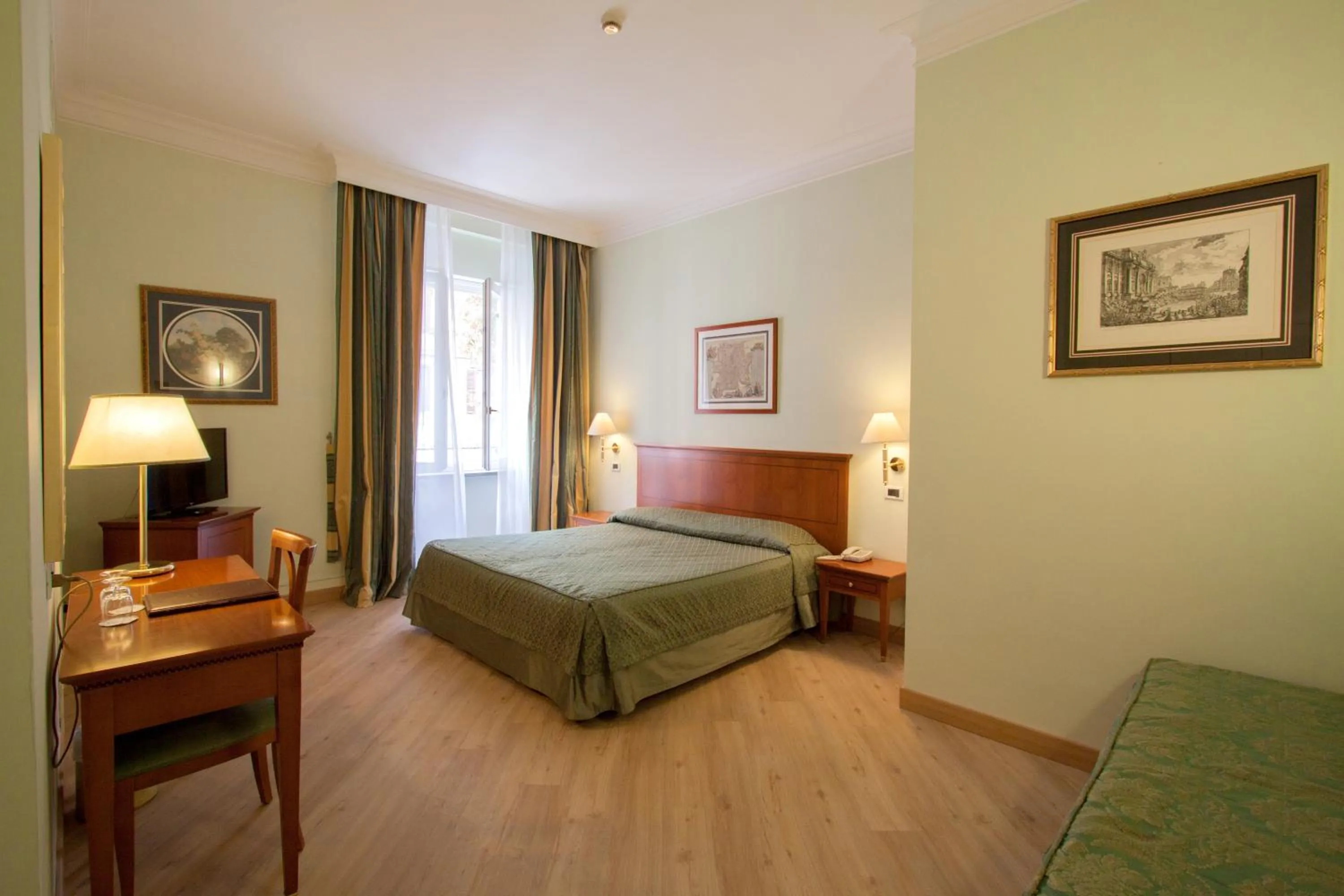 Photo of the whole room, Bed in Ateneo Garden Palace