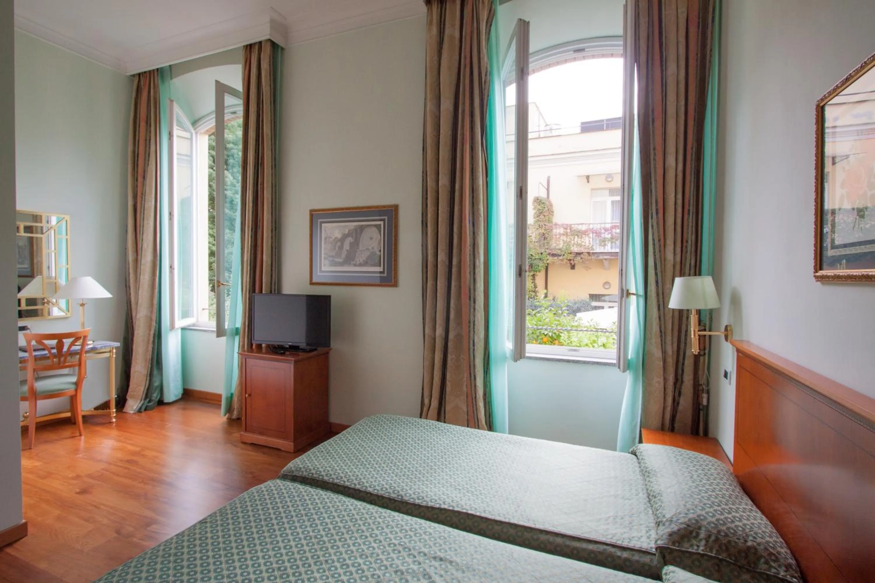 Photo of the whole room, Bed in Ateneo Garden Palace