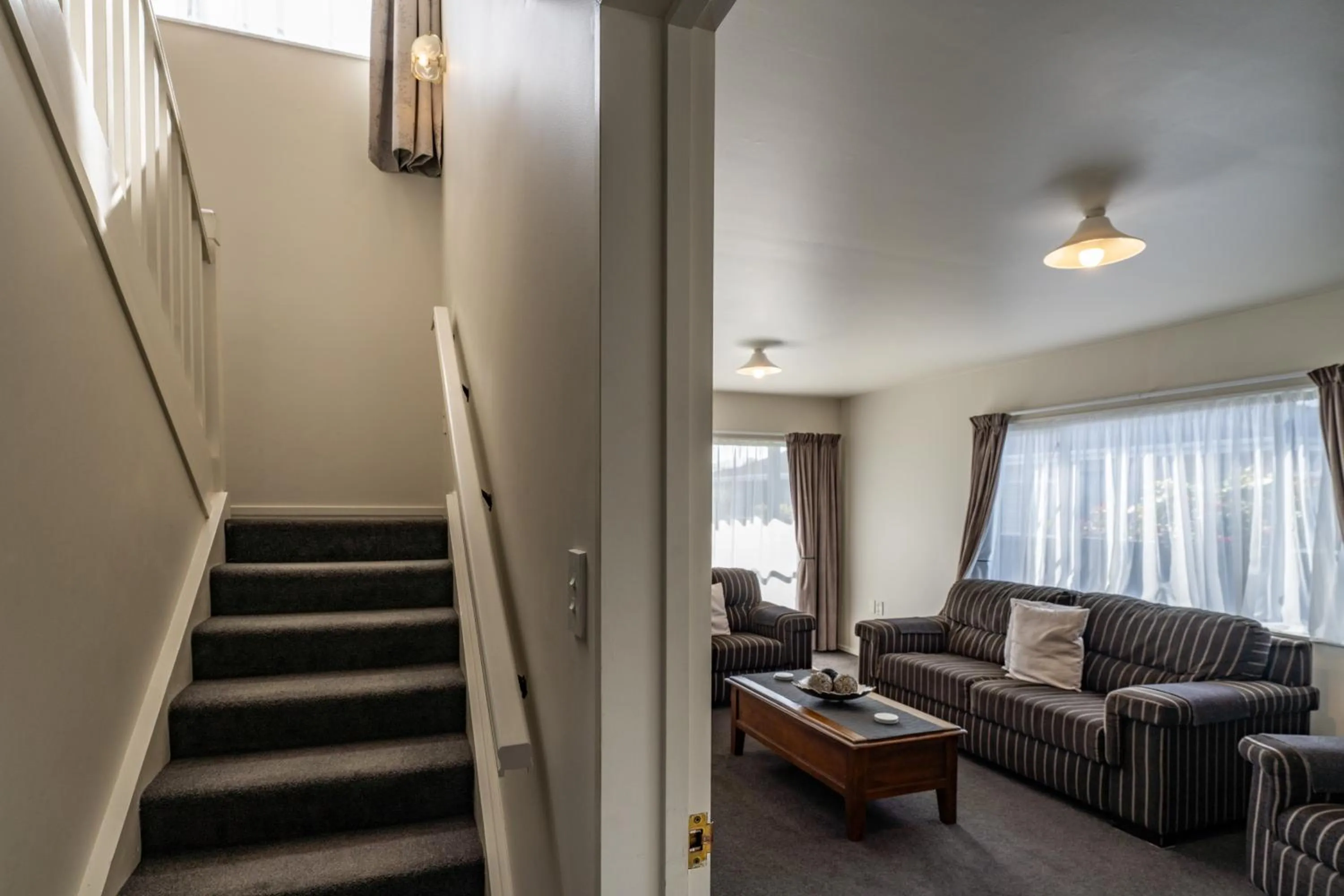 Seating area in ASURE Gables Motor Lodge