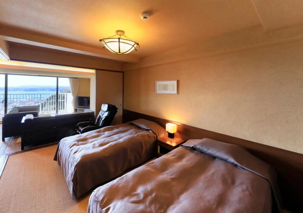 Bed in Katsuura Hilltop Hotel & Residence