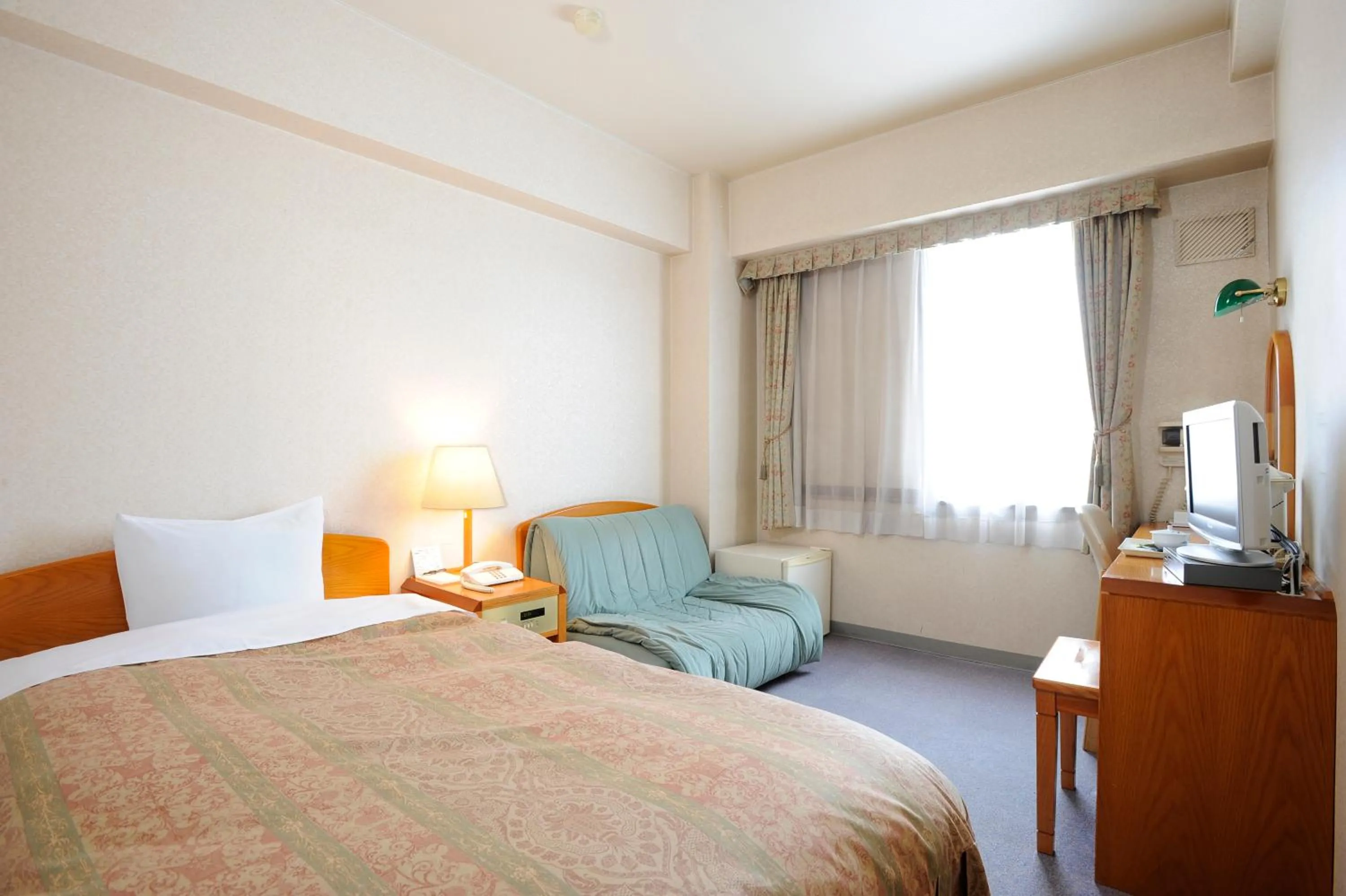 Bed in Shibetsu Grand Hotel