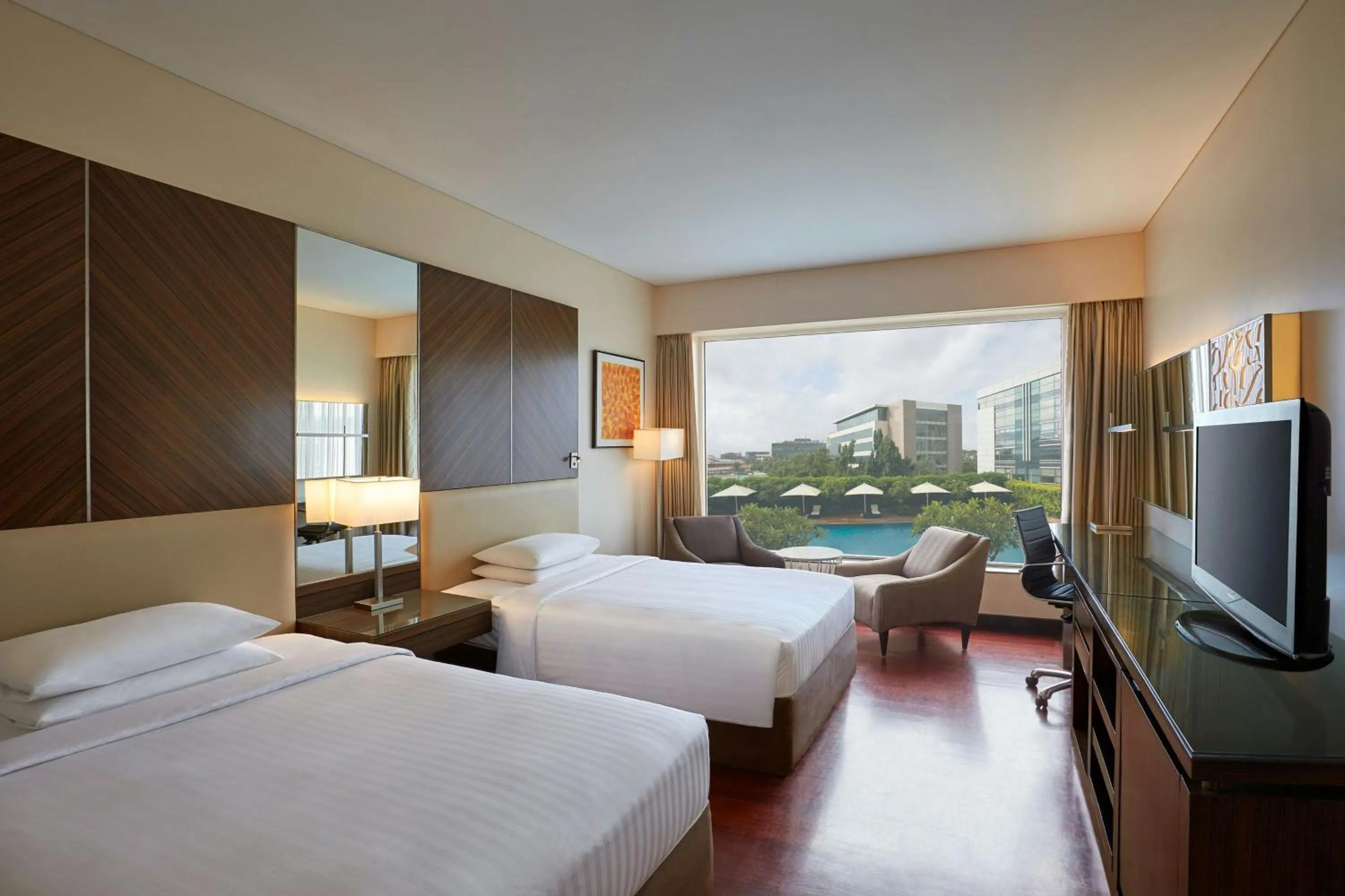 Swimming pool, Bed in Courtyard by Marriott Mumbai International Airport