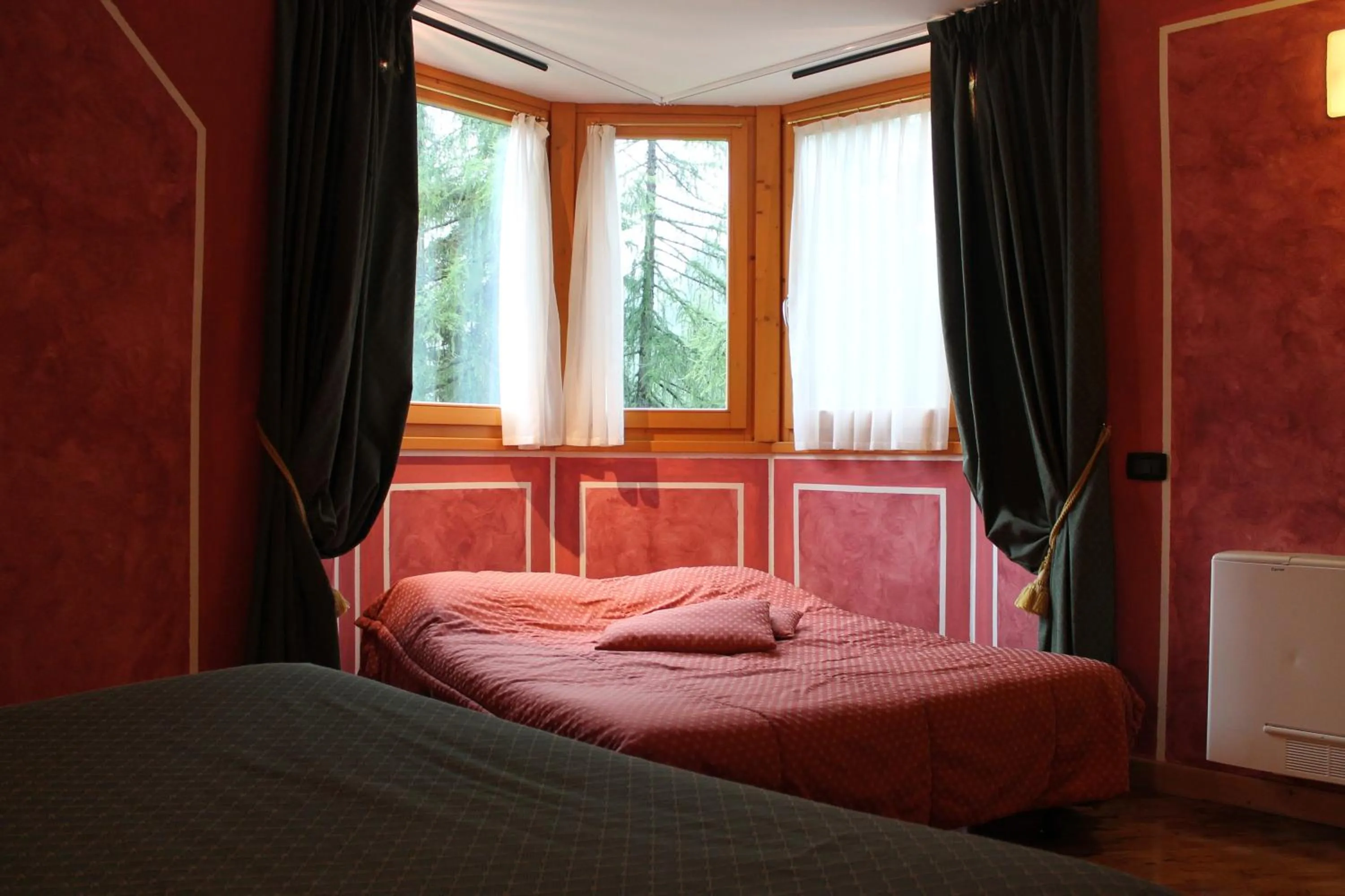 Bed in Boscone Suite Hotel