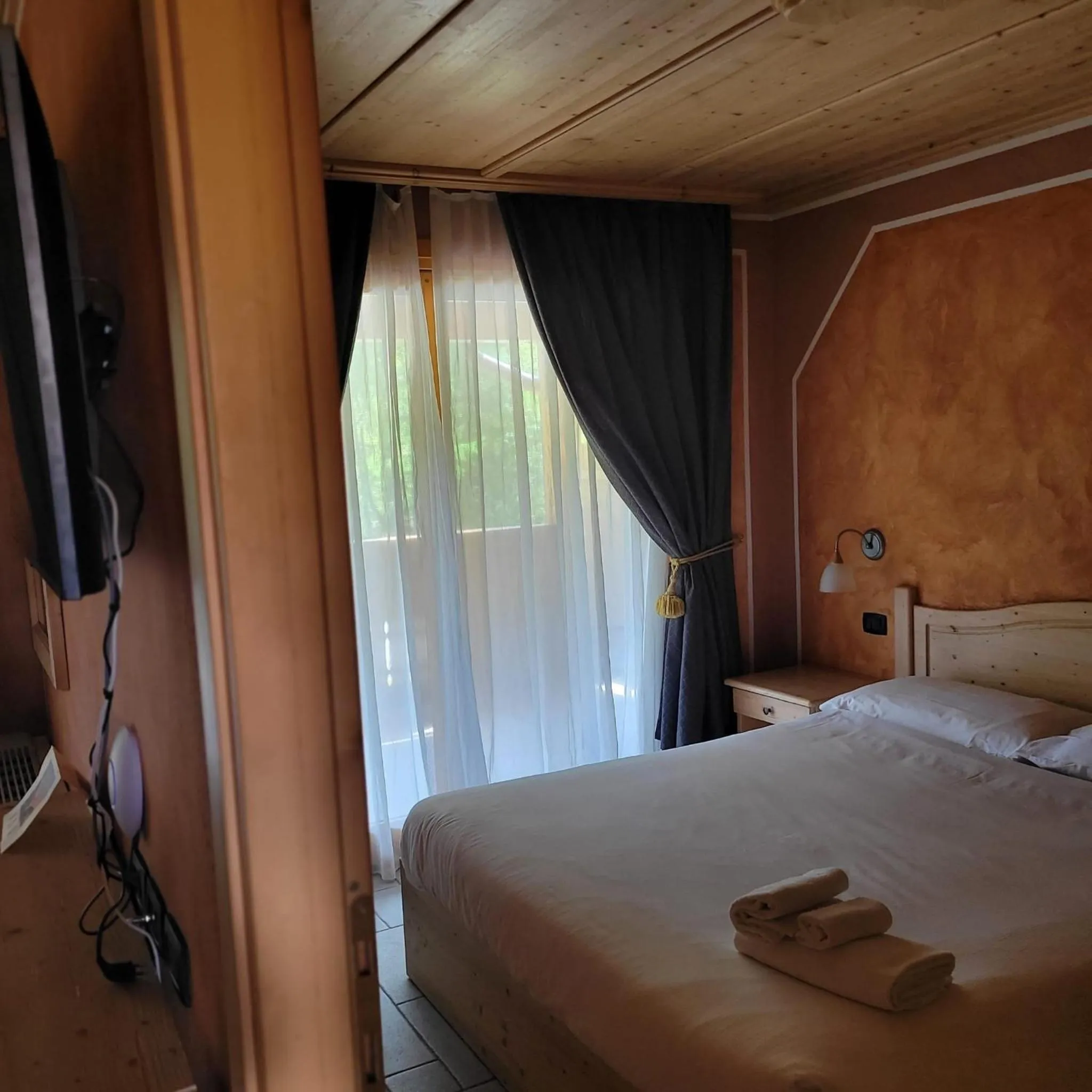 Bed in Boscone Suite Hotel