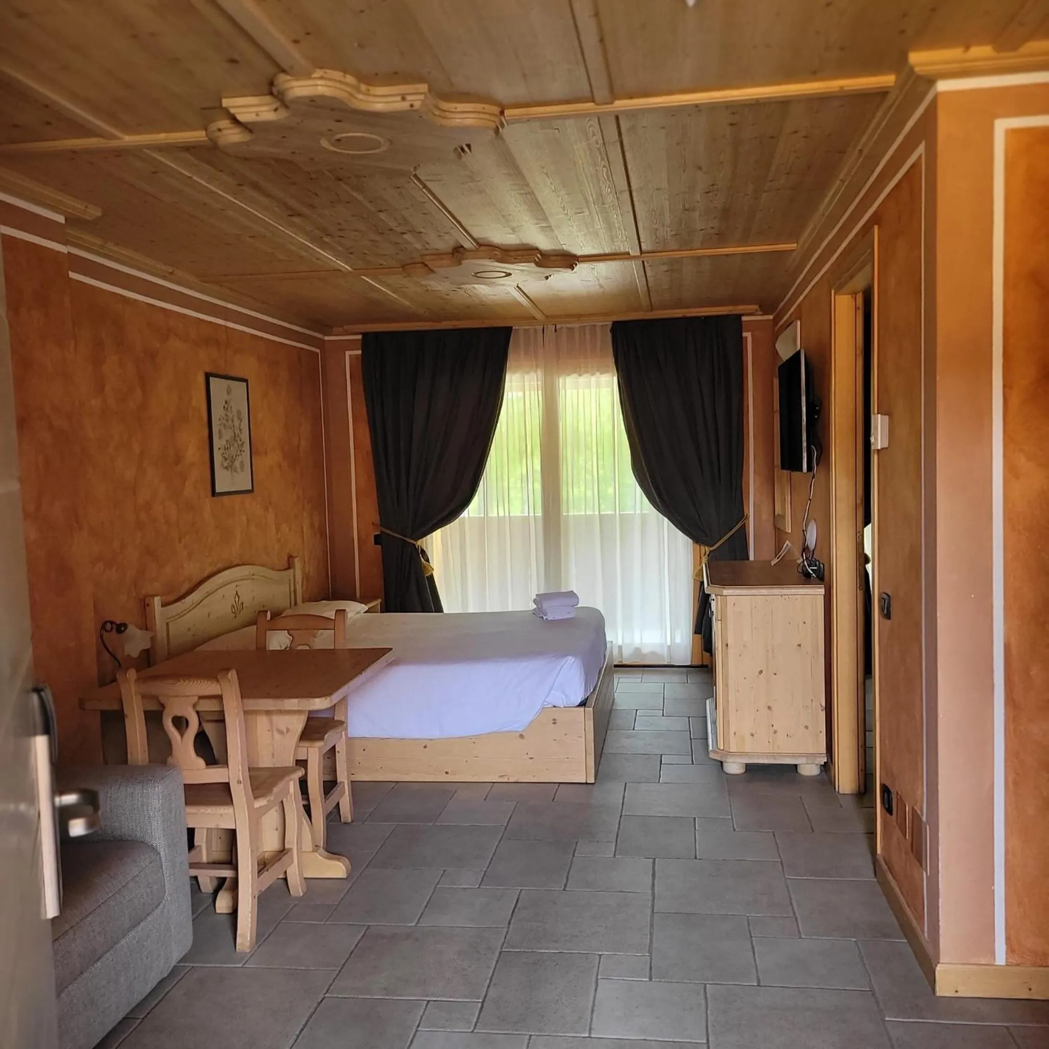 Bed in Boscone Suite Hotel