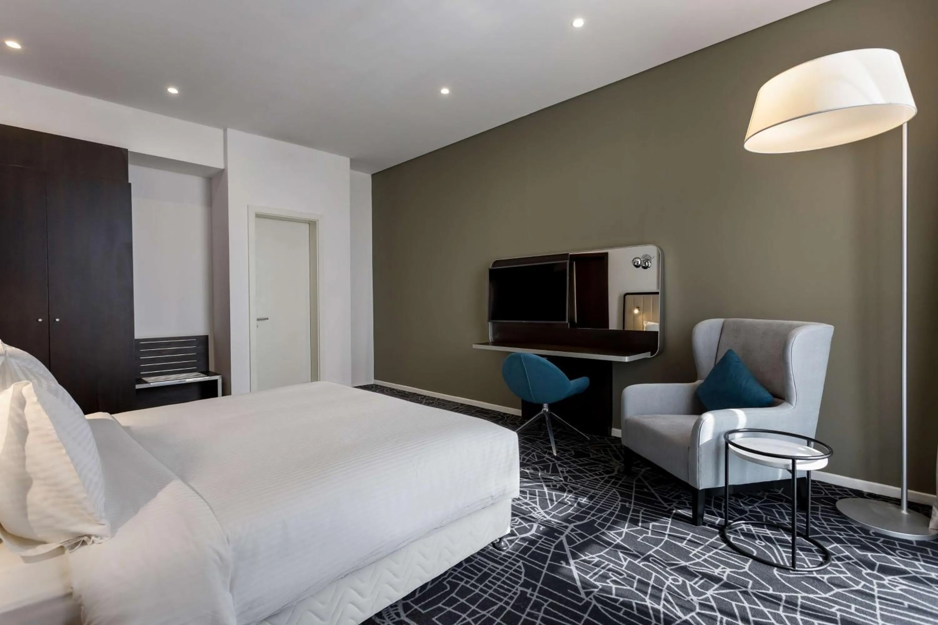 Photo of the whole room, Bed in Radisson Hotel & Apartments Dammam Industrial City