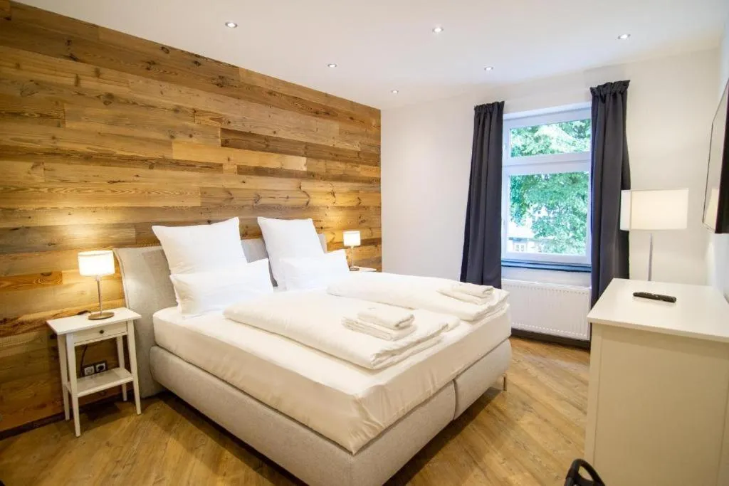 Bed in Schiefer Suite Hotel & Apartments