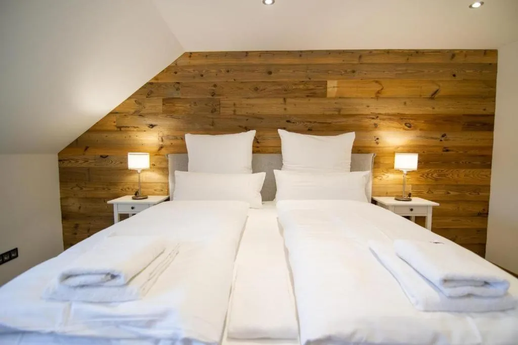 Bed in Schiefer Suite Hotel & Apartments