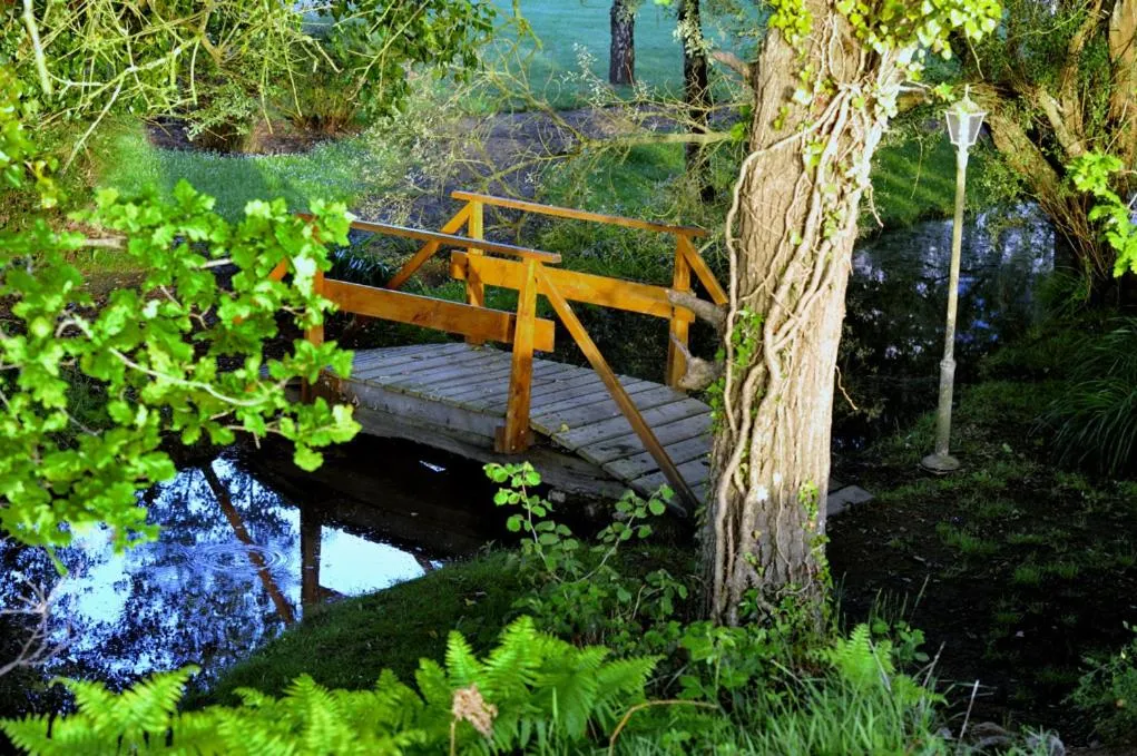 Garden in Logis Hôtel Restaurant Relais Du Gué De Selle
